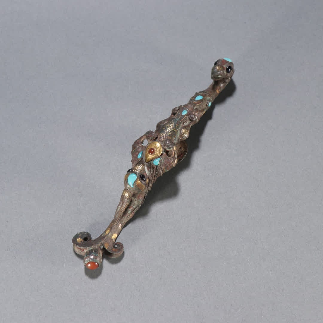 A Han Dynasty copper gold and silver belt hook (1 of 9)