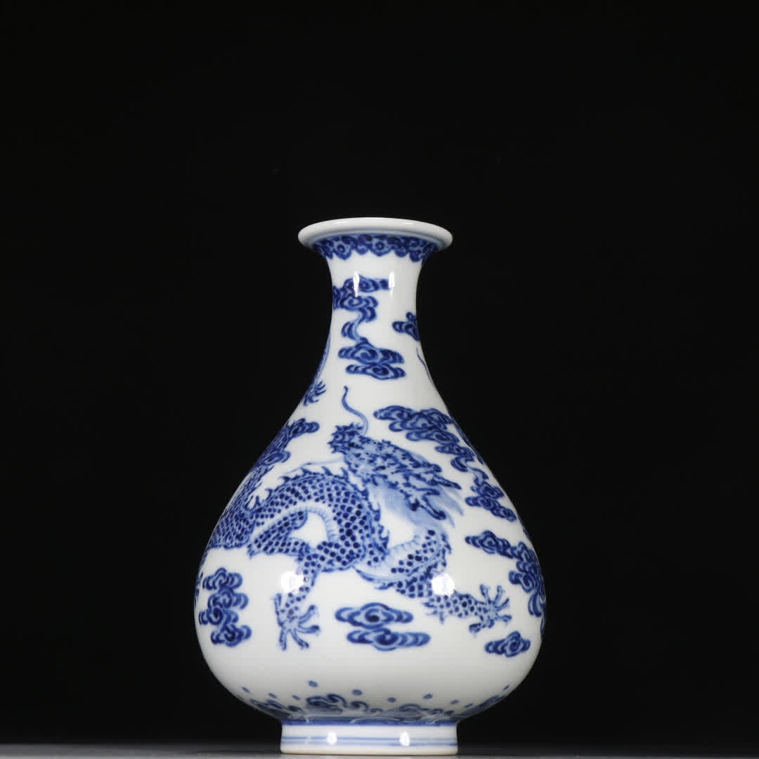 A Qing Dynasty blue and white cloud dragon pattern bottle (1 of 9)