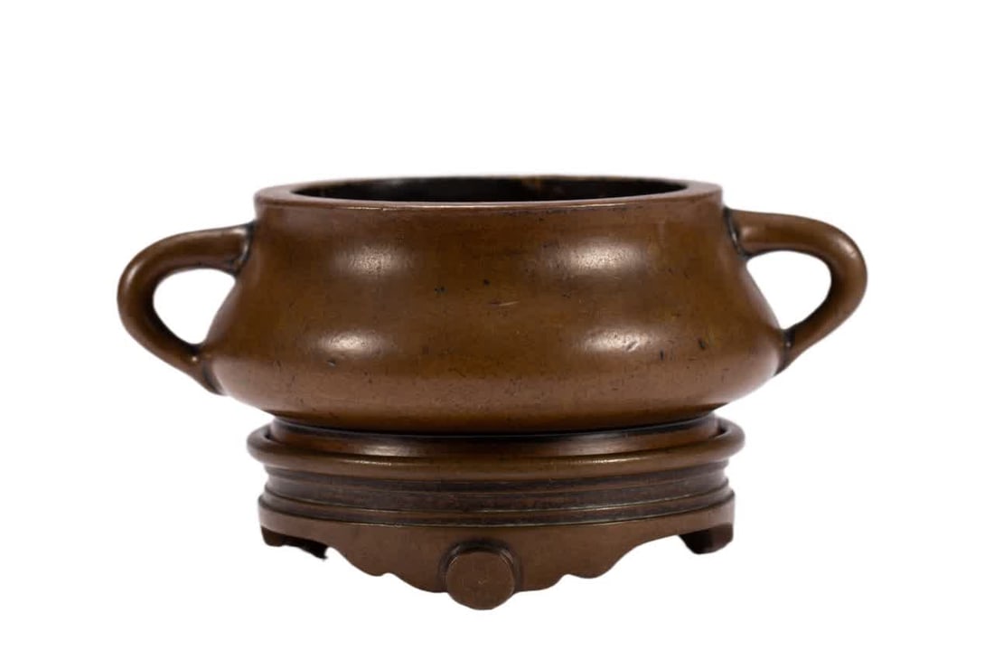 A Qing Dynasty copper incense burner (1 of 9)