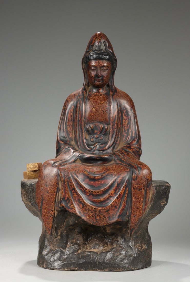 A Qing Dynasty wooden rhinoceros leather lacquer rock Guanyin ornament: Qing Dynasty wooden tire rhinoceros leather lacquer seat rock Guanyin ornament Size:H:36.5cmL: 23cmW:12cmW:1.16kg (The Dimensions Of All Batches Are Manually Measured.If You Need