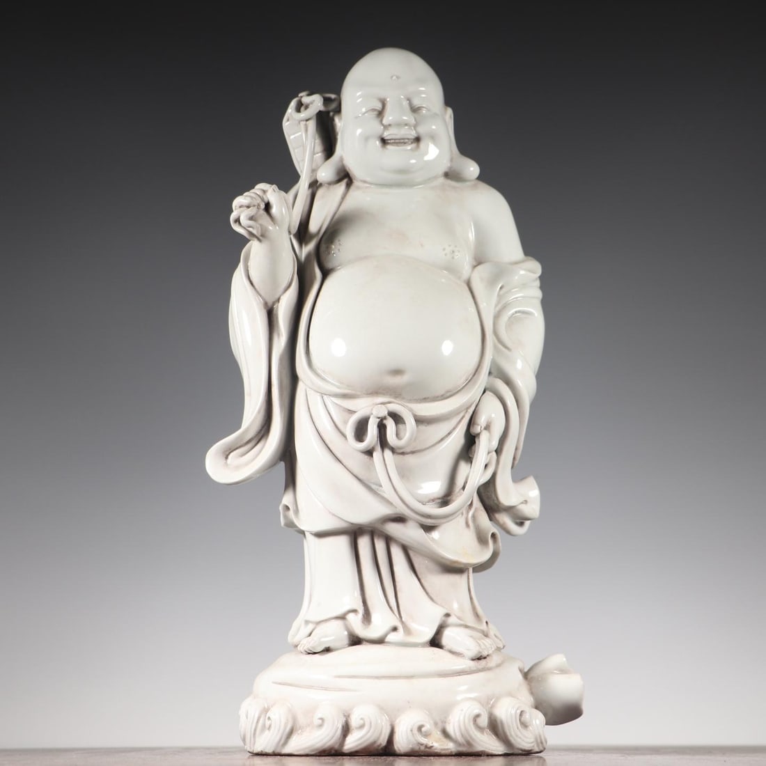 A dehua porcelain Maitreya Buddha statue (1 of 8)