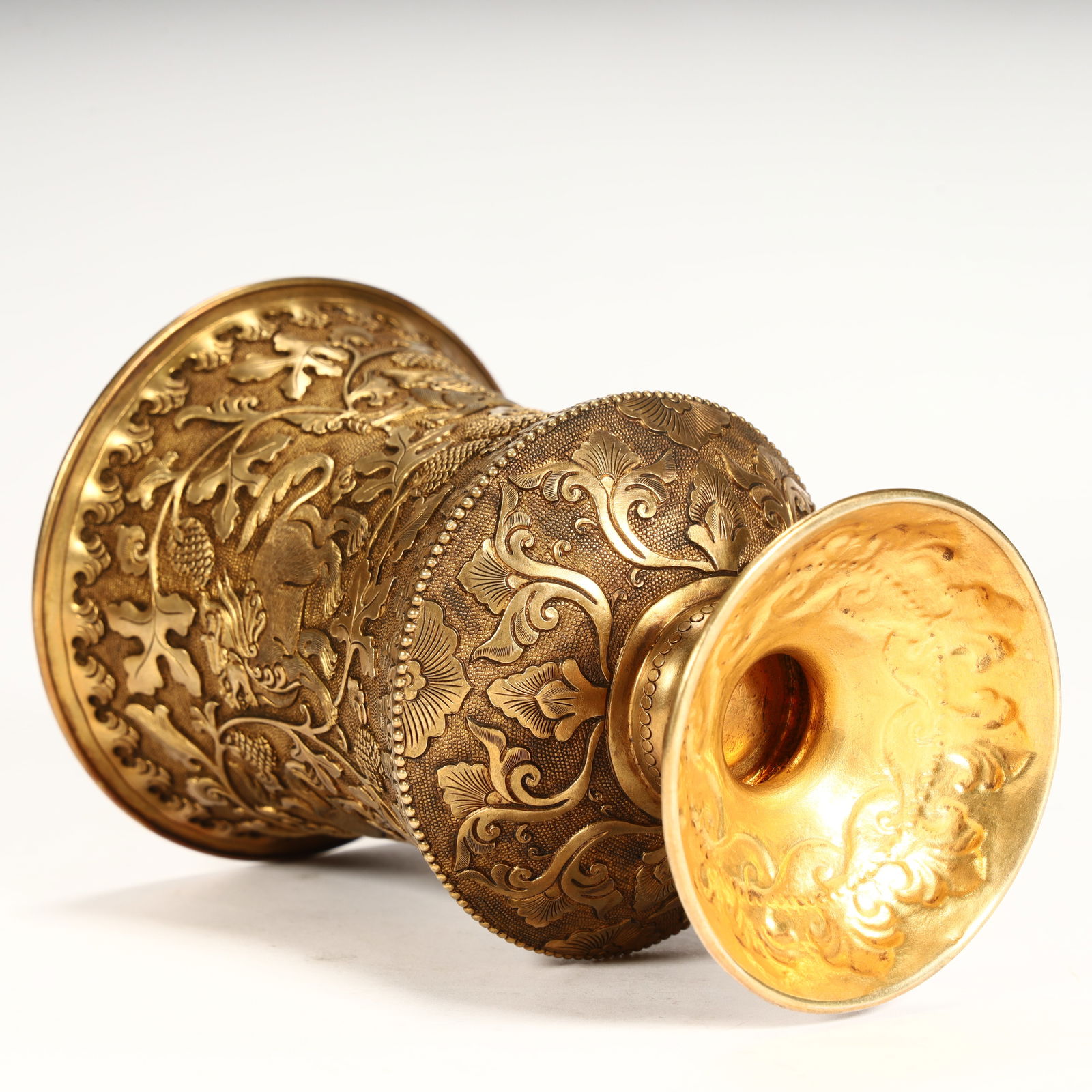 A fine copper-gilt grape-patterned goblet. - 11