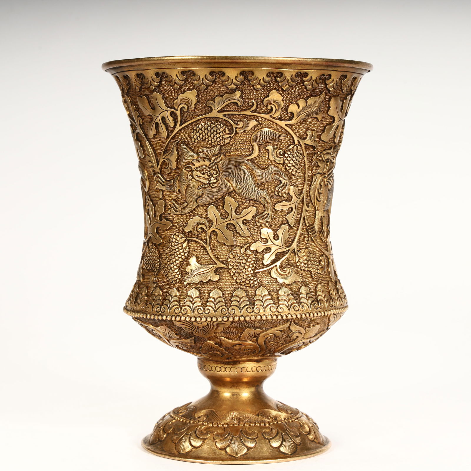A fine copper-gilt grape-patterned goblet. - 2