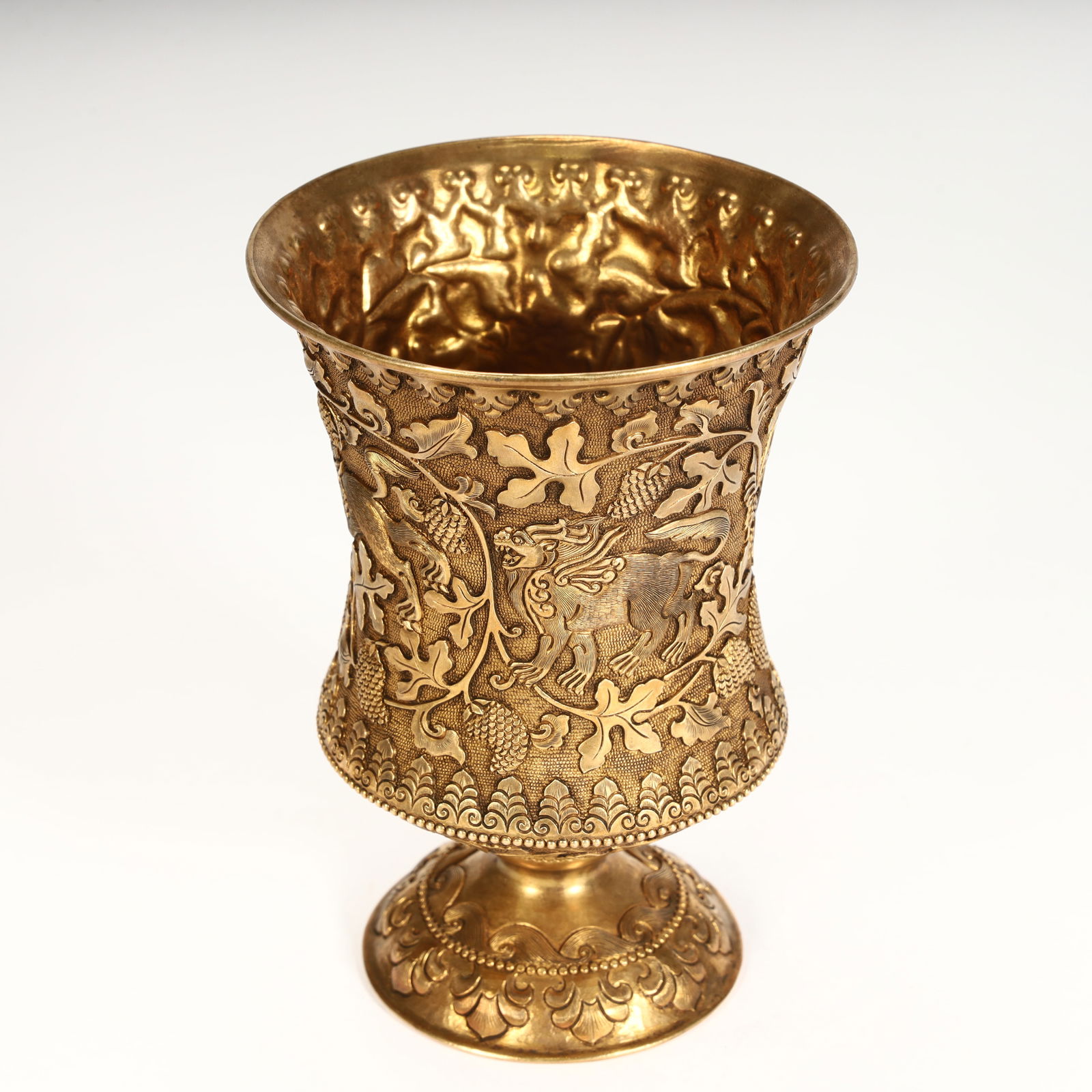 A fine copper-gilt grape-patterned goblet. - 6