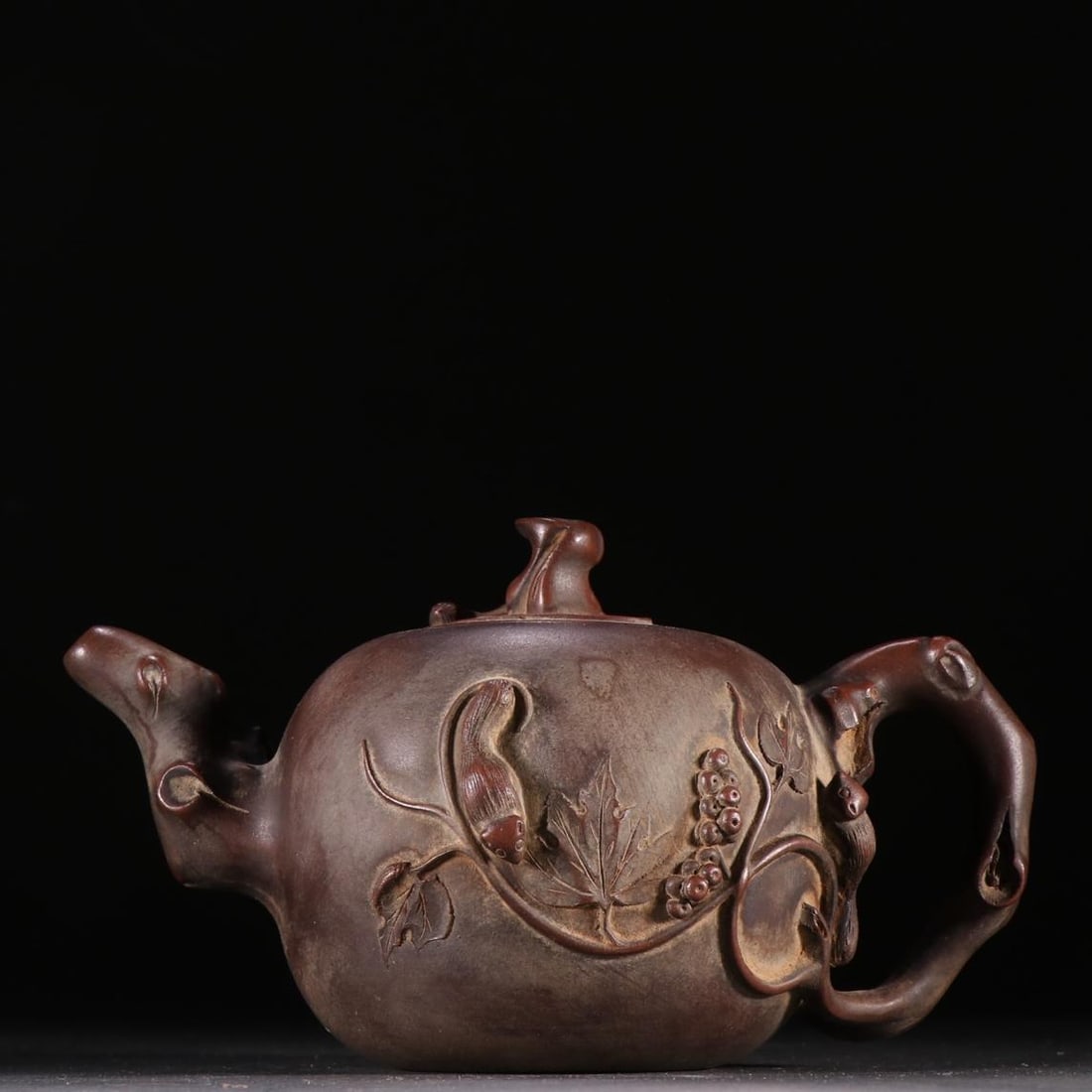 A Yixing purple sand squirrel grape teapot: Yixing's purple sand squirrel grape teapot Size:H:8cmW:16.2cm (The Dimensions Of All Batches Are Manually Measured.If You Need More Detailed Information, Please Contact Our Customer