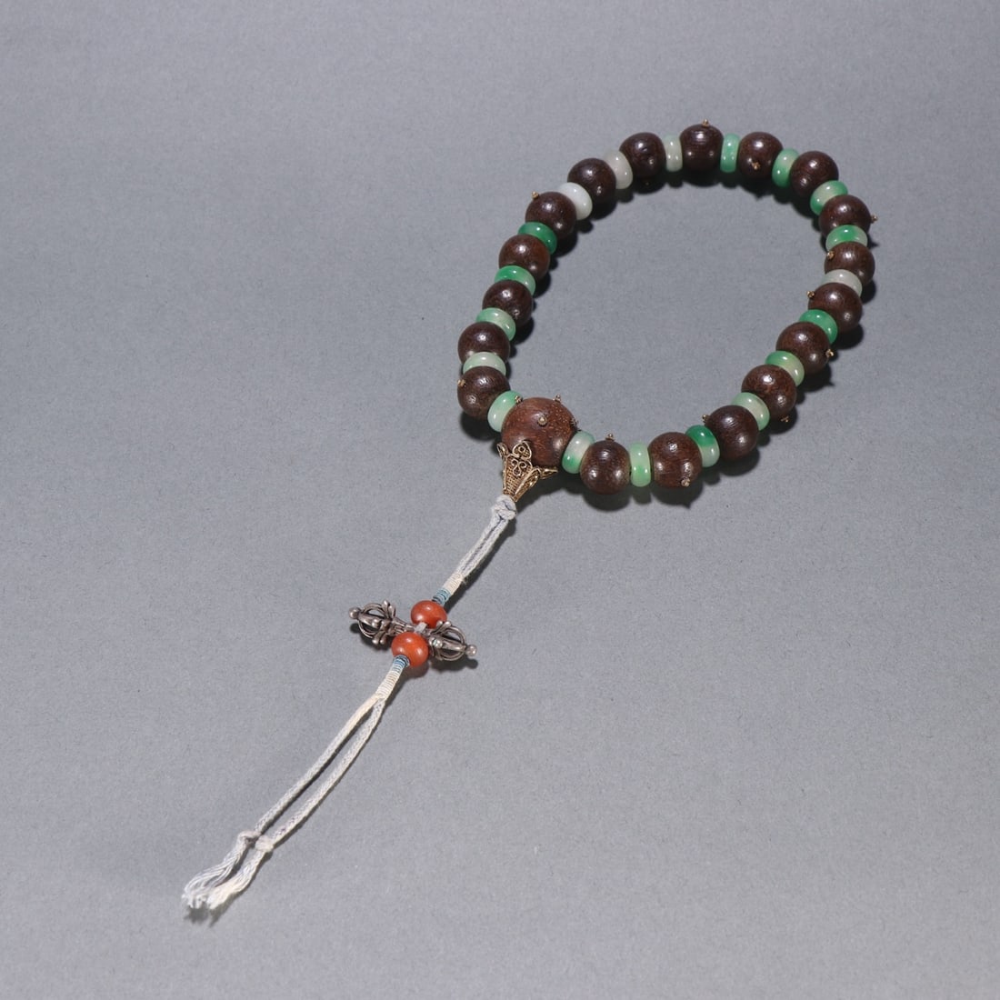 A piece of agarwood from the Qing Dynasty held by eighteen jade beads (1 of 9)