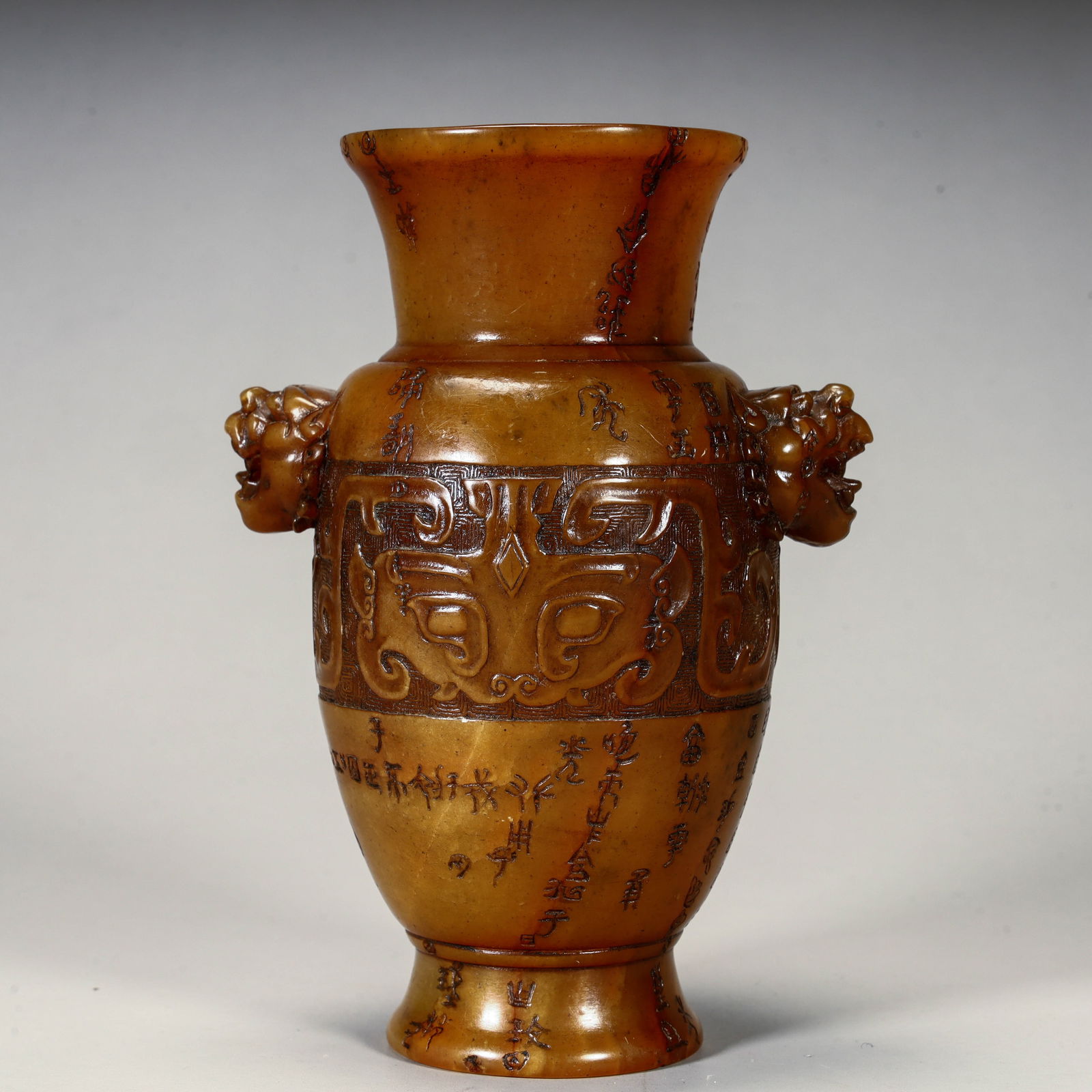 A Qing Dynasty Tian Huang stone beast face pattern ear bottle (1 of 10)