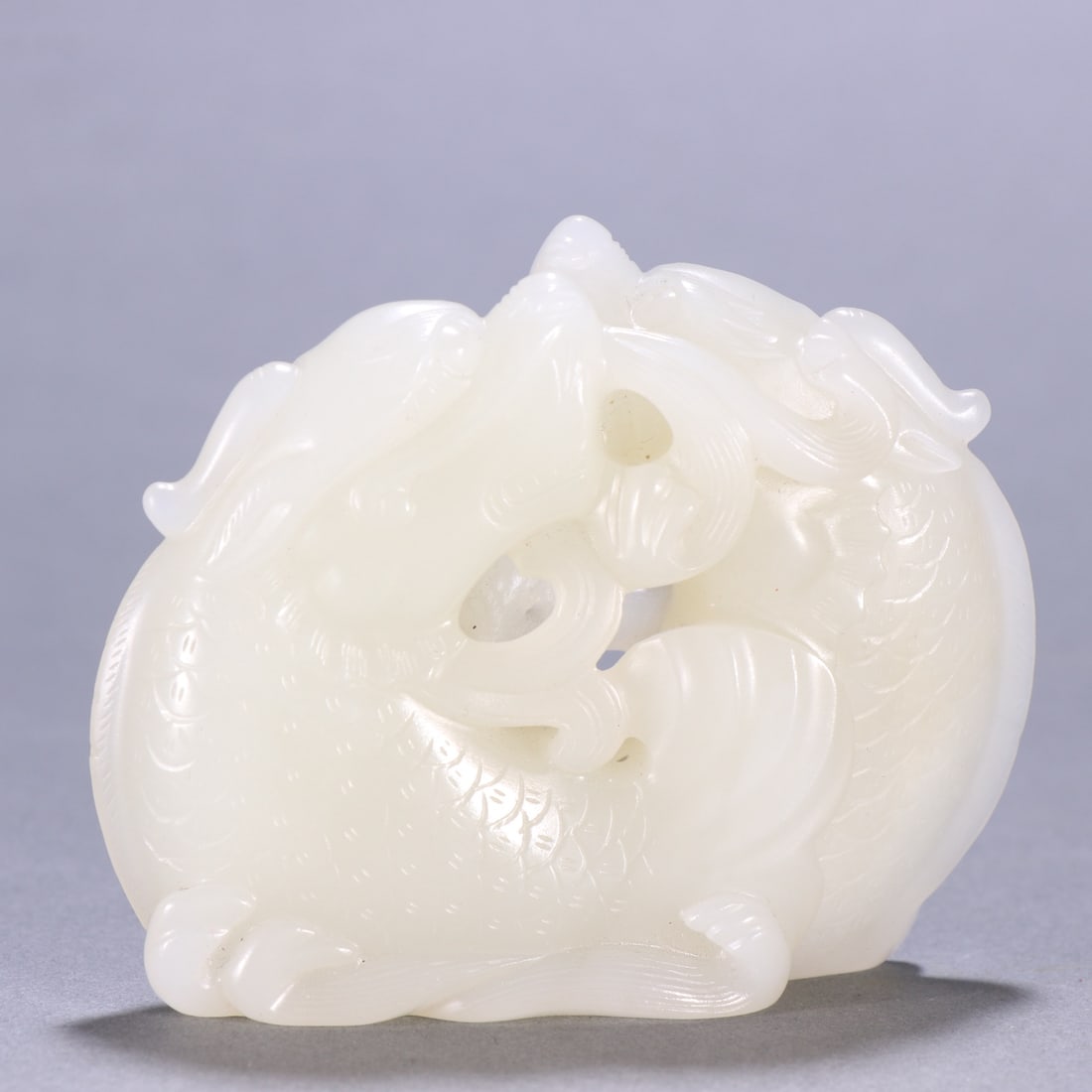 A Qing Dynasty Hetian jade fish dragon ornament (1 of 8)