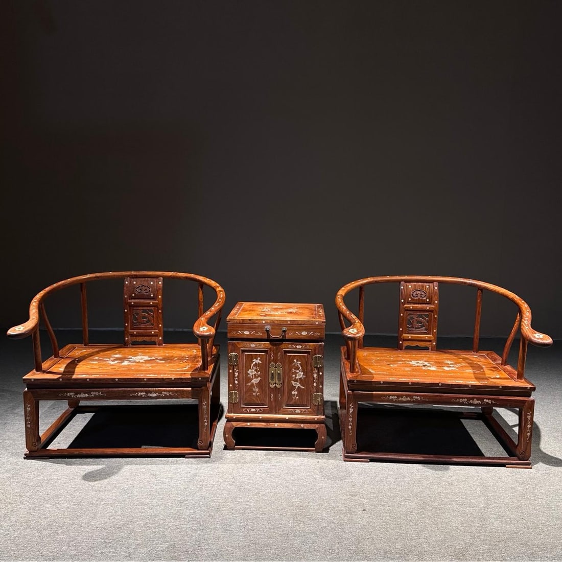 A three-piece set of exquisite yellow rosewood inlaid shell Zen chair throne set: Exquisite yellow rosewood inlaid shell Zen chair throne three-piece set Size:Lounge chair87×62×82cmcoffee table48×45×68cm (The Dimensions Of All Batches Are Manually Measured.If