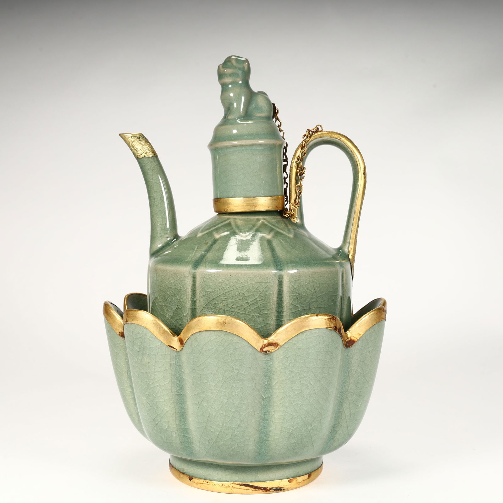 A Song Dynasty celadon open-piece gilt warm wine pot: Song Dynasty celadon open-piece gilt warm wine pot SIZE: PotH:21cm L: 14cm W:11.5cm 578gH:9.5cm L: 16cm W:16cm W:735g (The Dimensions Of All Batches Are Manually Measured.If You