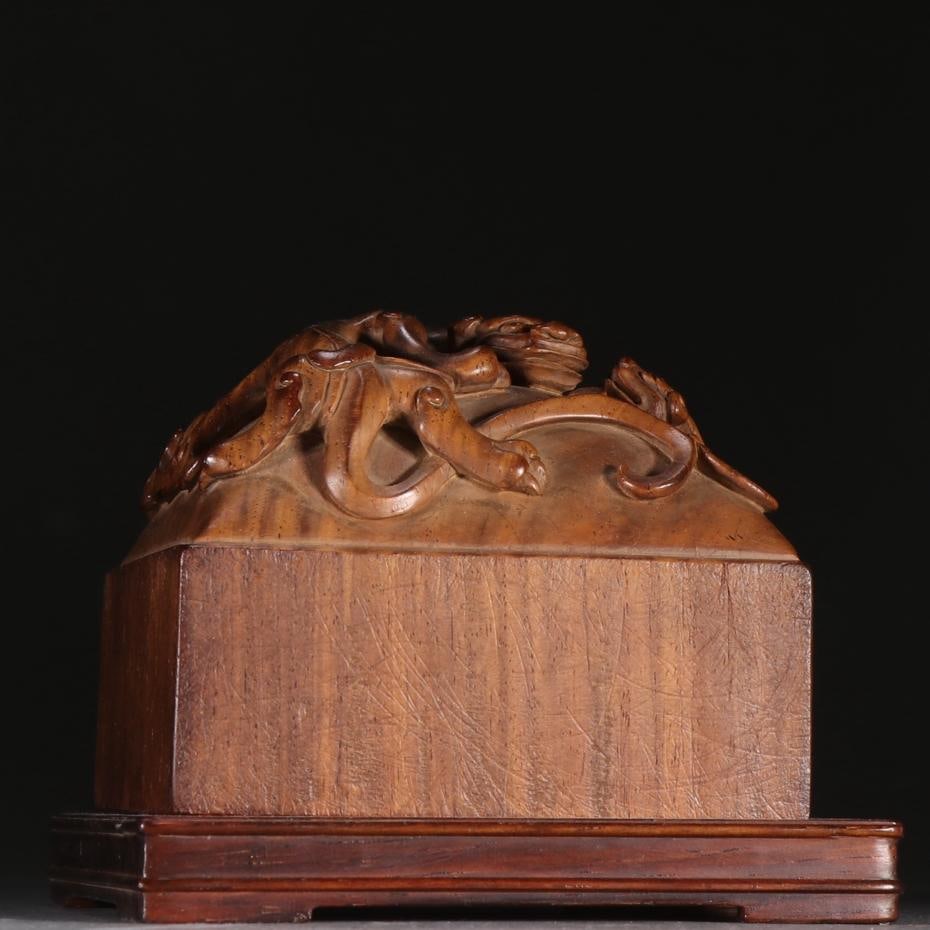 A Qing Dynasty Huanghuali carved dragon twisted seal: Qing Dynasty Huanghuali carved dragon twisted seal Size:H:8.1cmW:9.8cmW:0.68kg (The Dimensions Of All Batches Are Manually Measured.If You Need More Detailed Information, Please Contact Our Customer S