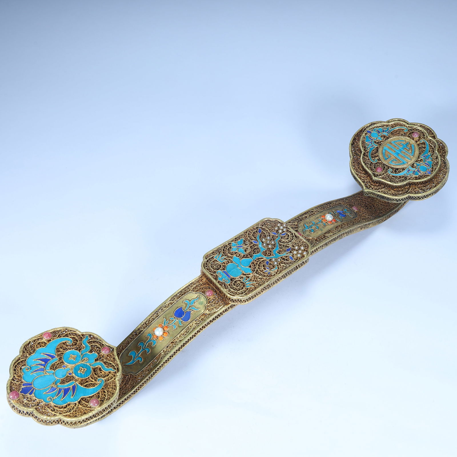 A beautiful silver-gilt silk burnt blue inlaid treasure ruyi: Exquisite silver gilt silk burnt blue inlaid treasure ruyi SIZE: H:8cm L: 45cm W:10.5cm W:691g (The Dimensions Of All Batches Are Manually Measured.If You Need More Detailed Information, Please Contac