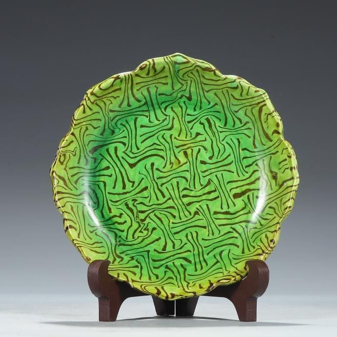 A Tang Dynasty green-glazed twisted three-legged sunflower mouth plate: Tang Dynasty's green glazed twisted tire three-legged sunflower mouth plate Size:H:4.5cmD:15cm (The Dimensions Of All Batches Are Manually Measured.If You Need More Detailed