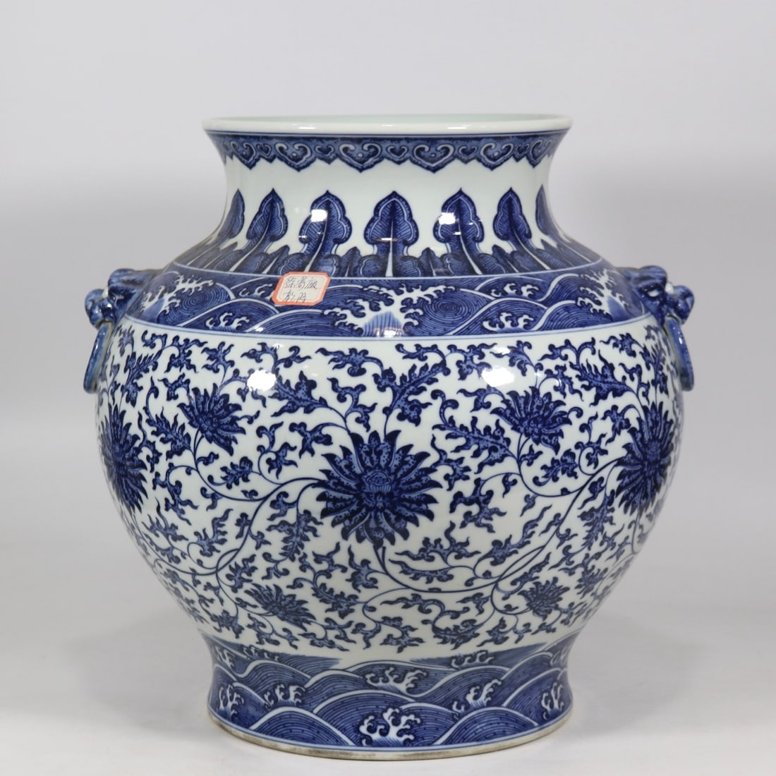 An Exquisite Blue and White Lotus Pattern Seawater Pattern Double-Ears Vase: An Exquisite Blue and White Lotus Pattern Seawater Pattern Double-Ears Vase Qing Dynasty, China Qianlong Six-character Mark Size:39.5cmx36cm (The Dimensions Of All Batches Are Manually Measured.If