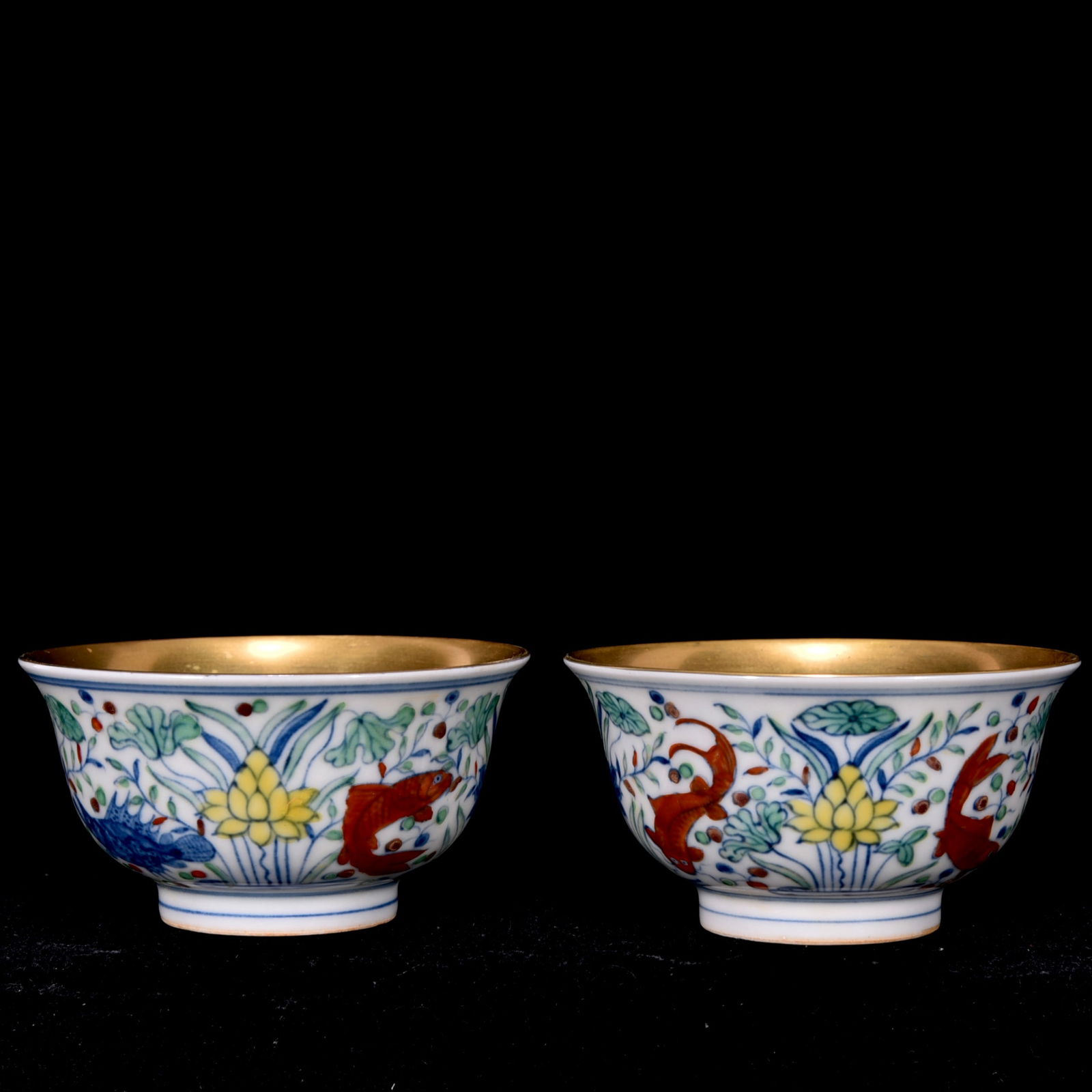 An Exquisite Doucai Painted Gold Fish and Lotus Pattern Cup: An Exquisite Doucai Painted Gold Fish and Lotus Pattern Cup Ming Dynasty, China Chenghua Six-character Mark Size:4.5cmx8.5cm (The Dimensions Of All Batches Are Manually Measured.If You Need More