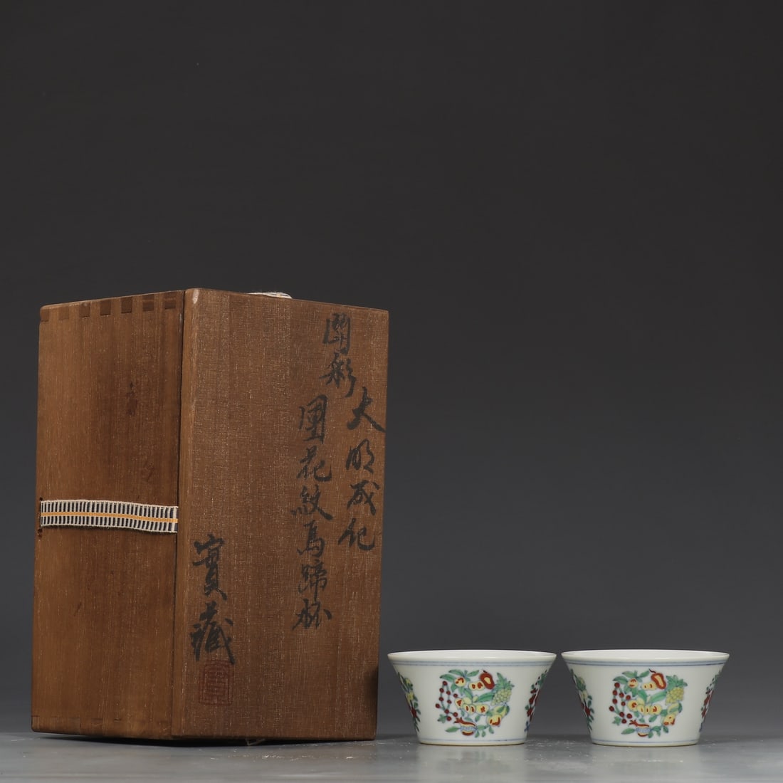 A Pair of Exquisite Doucai Flower and Fruit Pattern Cup: A Pair of Exquisite Doucai Flower and Fruit Pattern Cup Ming Dynasty, China Chenghua Six-character Mark Size:4.3cmx8cm (The Dimensions Of All Batches Are Manually Measured.If You Need More Detailed