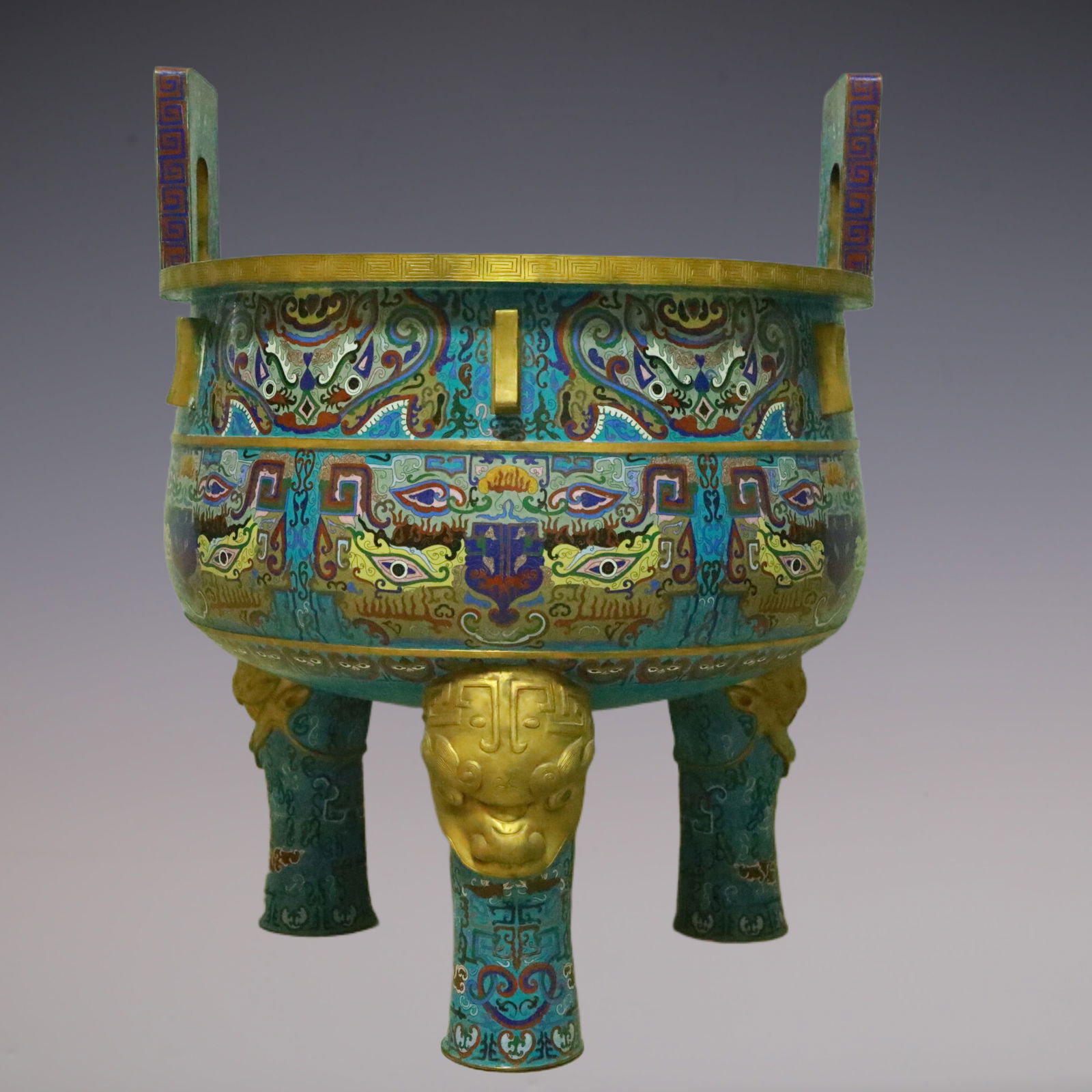 An Exquisite Cloisonne Beast-Face Pattern Double-Ears and Tripod Censer: An Exquisite Cloisonne Beast-Face Pattern Double-Ears and Tripod Censer Qing Dynasty, China Qianlong Four-character Mark Size:72cmx72cmx93cm (The Dimensions Of All Batches Are Manually Measured.If You