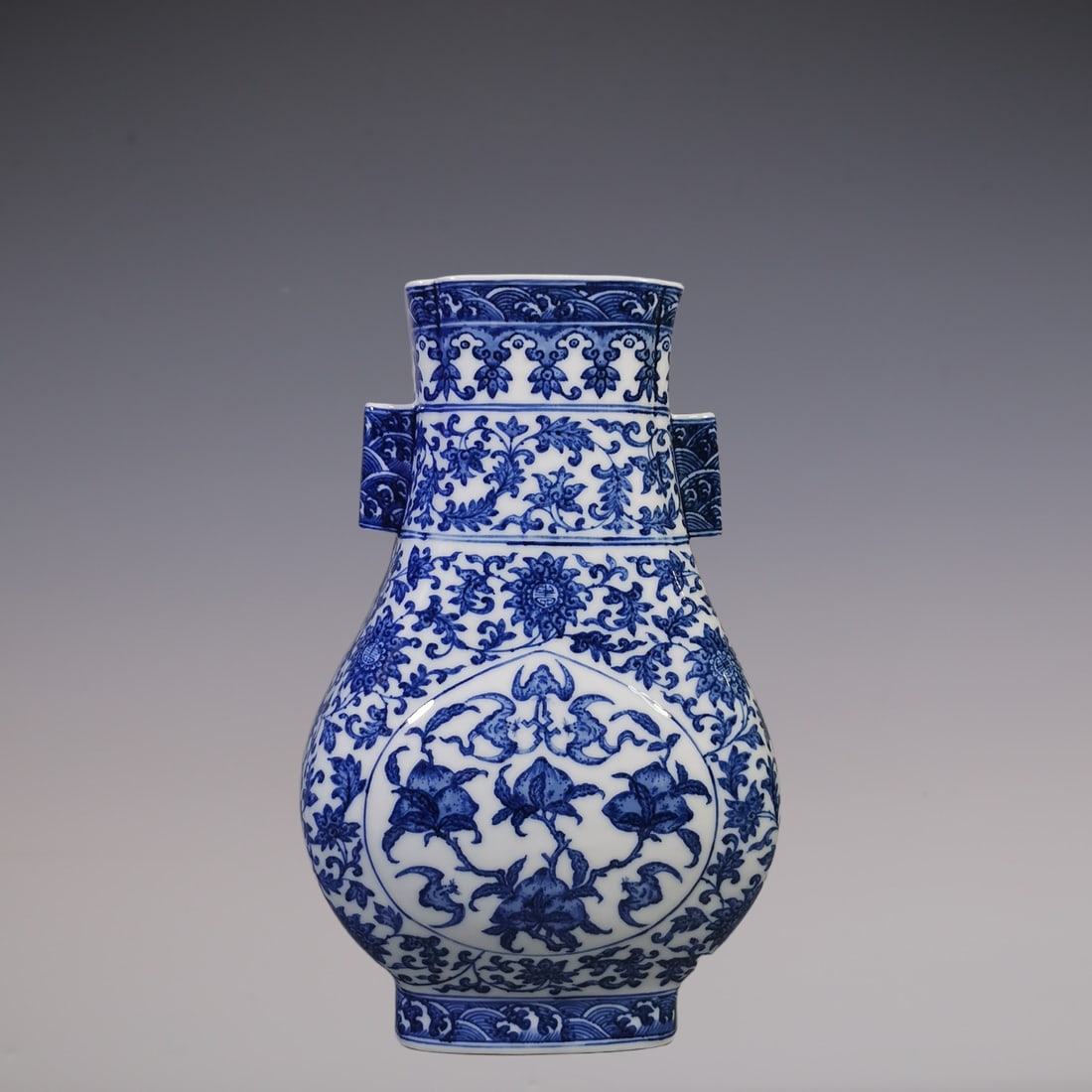 An Exquisite Blue and White Lotus Pattern Bats and Peach Pattern Seawater Pattern Double-Ears Vase: An Exquisite Blue and White Lotus Pattern Bats and Peach Pattern Seawater Pattern Double-Ears Vase Qing Dynasty, China Qianlong Six-character Mark Size:31cmx20cm (The Dimensions Of All Batches Are