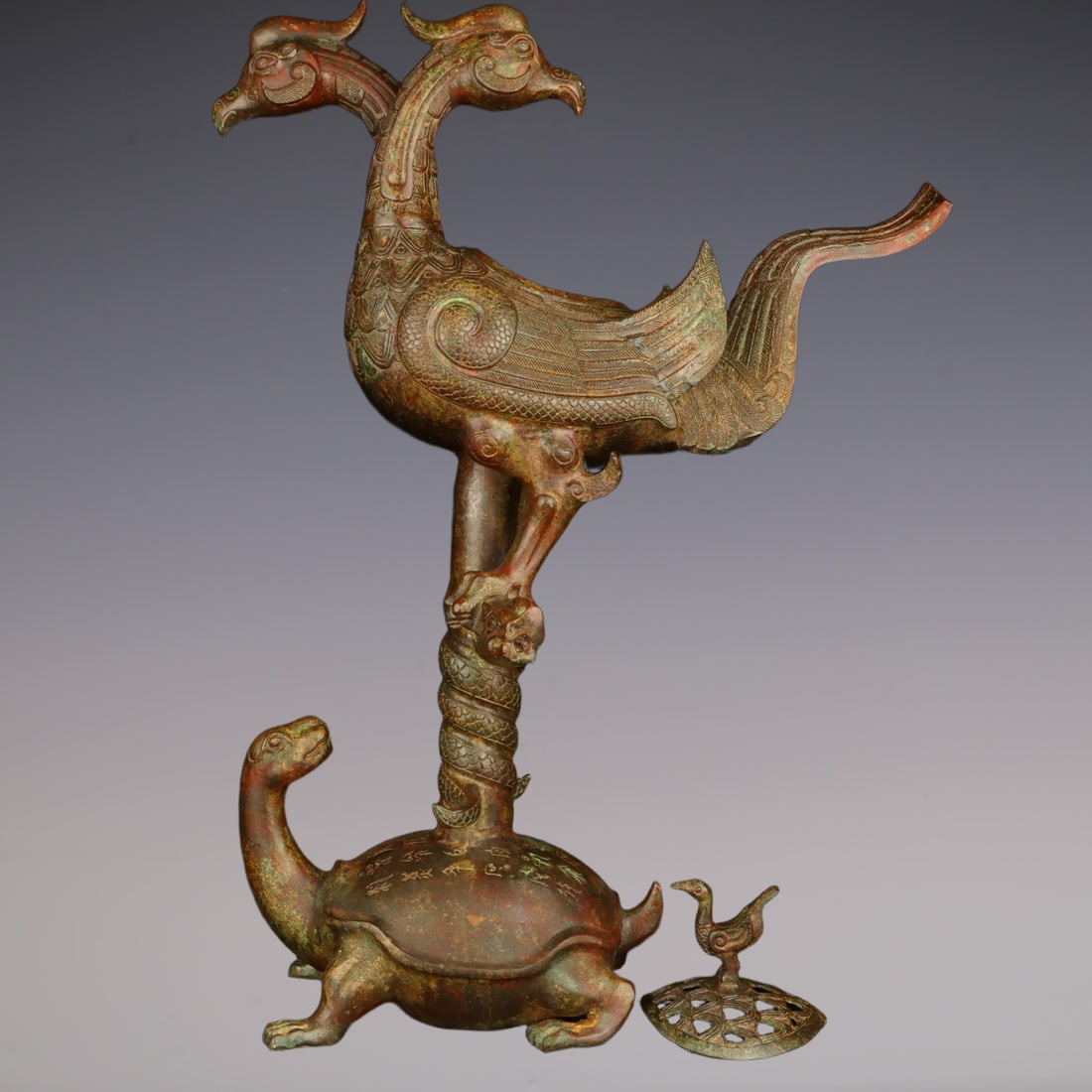 An Exquisite Bronze With Inscription Phoenix Turtle-Shaped Censer: An Exquisite Bronze With Inscription Phoenix Turtle-Shaped Censer Han Dynasty, China Size:46cmx64cm Weight:9750g (The Dimensions Of All Batches Are Manually Measured.If You Need More Detailed