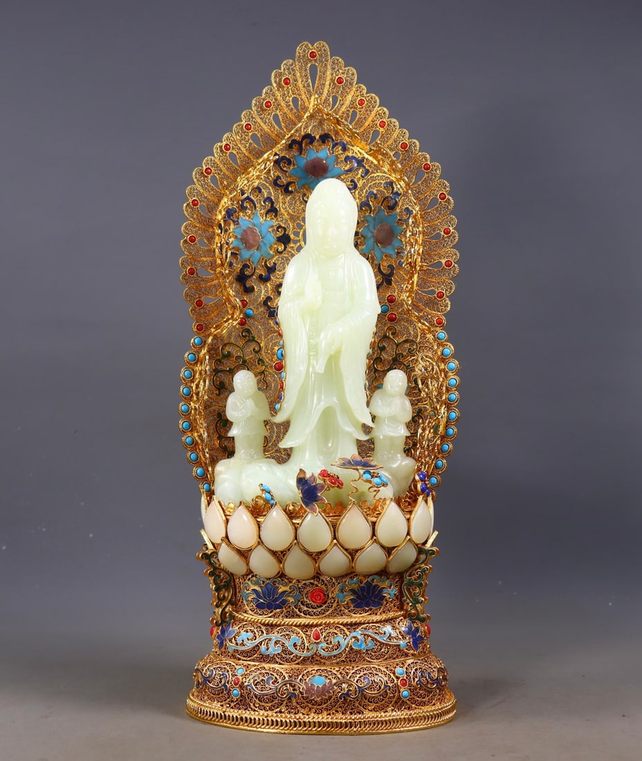 An Exquisite Gilt Bronze Inlaid White Jade Statue of Avalokitesvara: An Exquisite Gilt Bronze Inlaid White Jade Statue of Avalokitesvara Qing Dynasty, China Qianlong Four-character Mark Size:40cmx16cmx10cm Weight:1913g (The Dimensions Of All Batches Are Manually