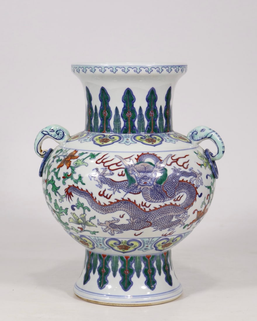 An Exquisite Doucai Dragon Pattern Lotus Pattern Double-Ears Vase: An Exquisite Doucai Dragon Pattern Lotus Pattern Double-Ears Vase Qing Dynasty, China Qianlong Six-character Mark Size:28.5cmx20cm (The Dimensions Of All Batches Are Manually Measured.If You Need