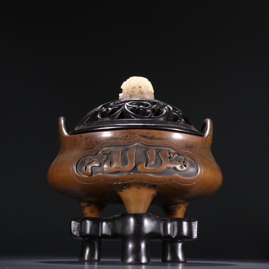 An Exquisite Bronze Inlaid White Jade With Inscription Double-Ears and Tripod Censer: An Exquisite Bronze Inlaid White Jade With Inscription Double-Ears and Tripod Censer Ming Dynasty, China Size:18cmx14.5cm Weight:2281g (The Dimensions Of All Batches Are Manually Measured.If You