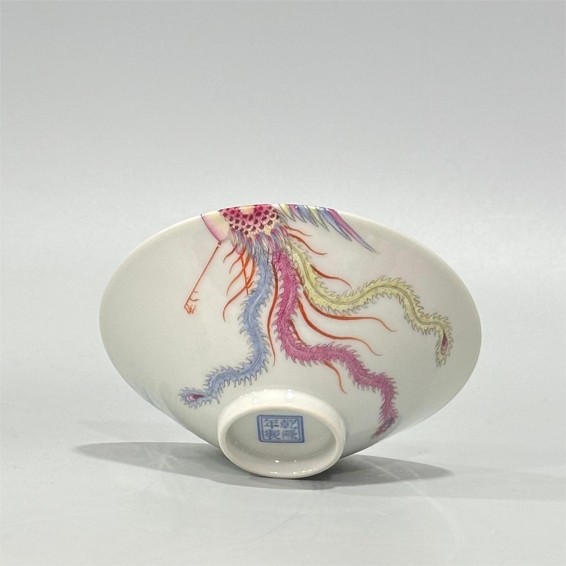 A Qing Dynasty Qianlong era enamel phoenix bamboo leaf pattern hat cup: Qing Dynasty Qianlong year enamel phoenix bamboo leaf pattern hat cup Size:H:3cmCalibre:9cm (The Dimensions Of All Batches Are Manually Measured.If You Need More Detailed