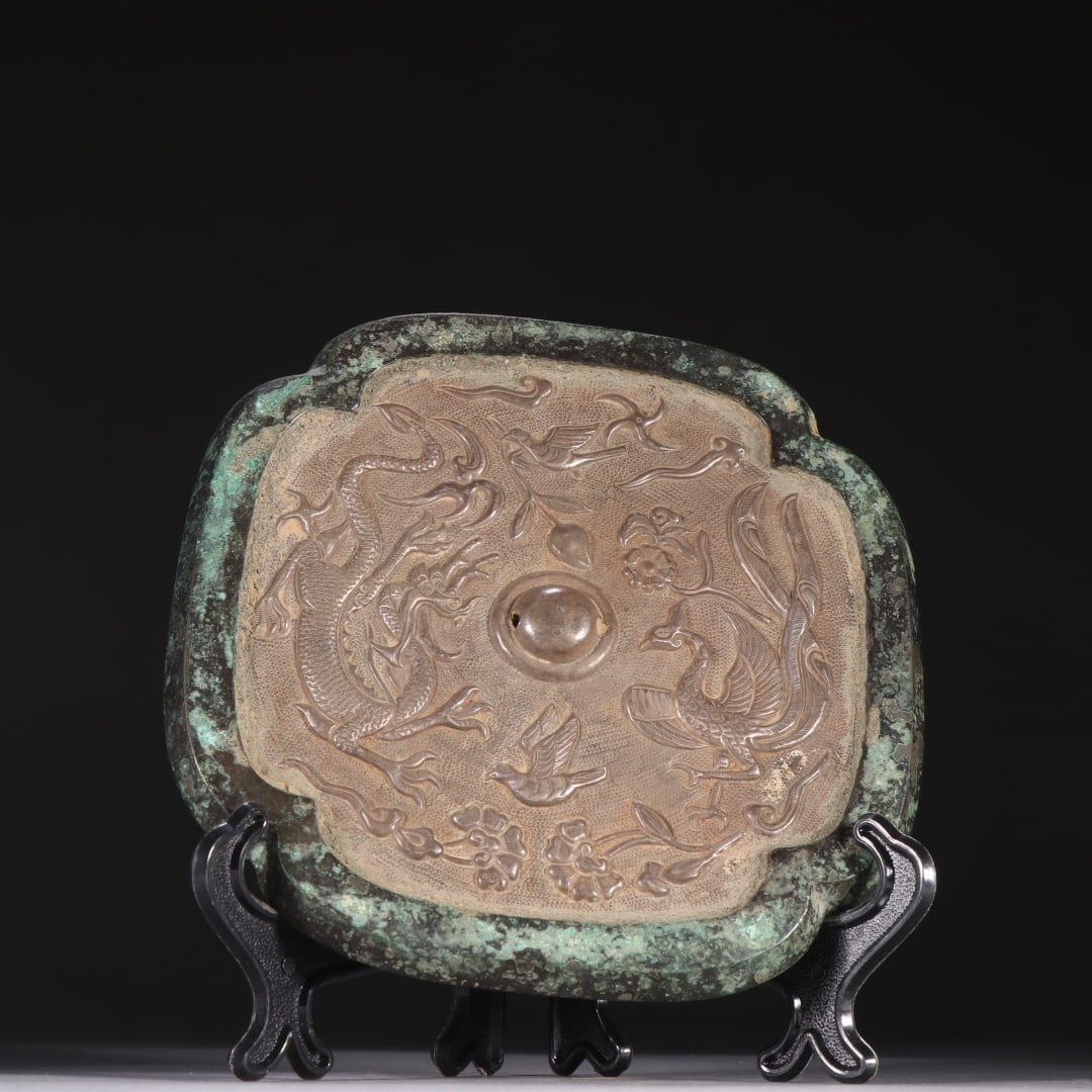 A copper-inlaid sterling silver engraved dragon and phoenix mirror from the Tang Dynasty (1 of 9)