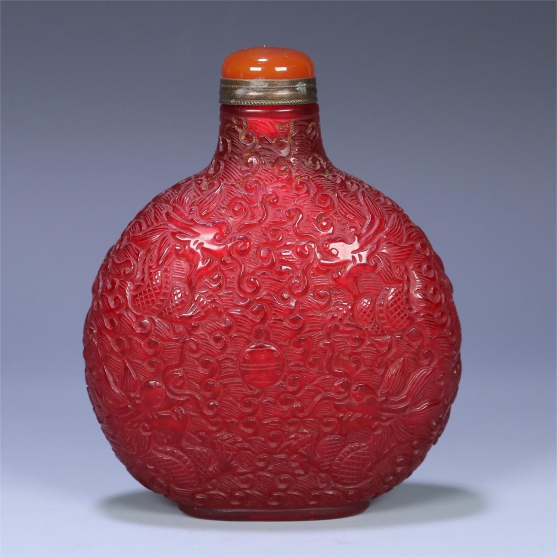 An old glazed nine-dragon pattern large snuff bottle from the Qing Dynasty (1 of 9)