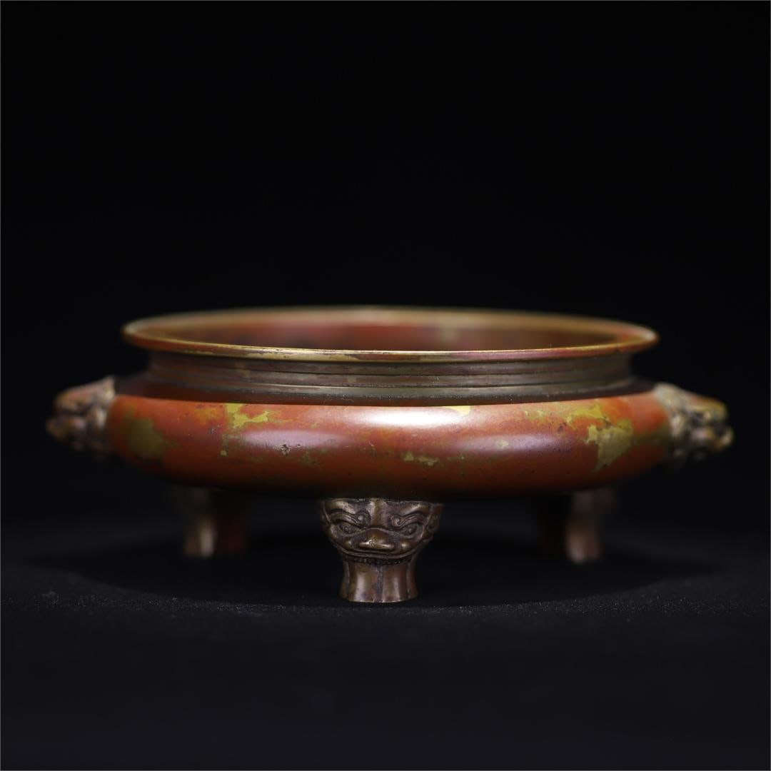 A three-legged copper incense burner with lion ears in the Qing Dynasty (1 of 9)