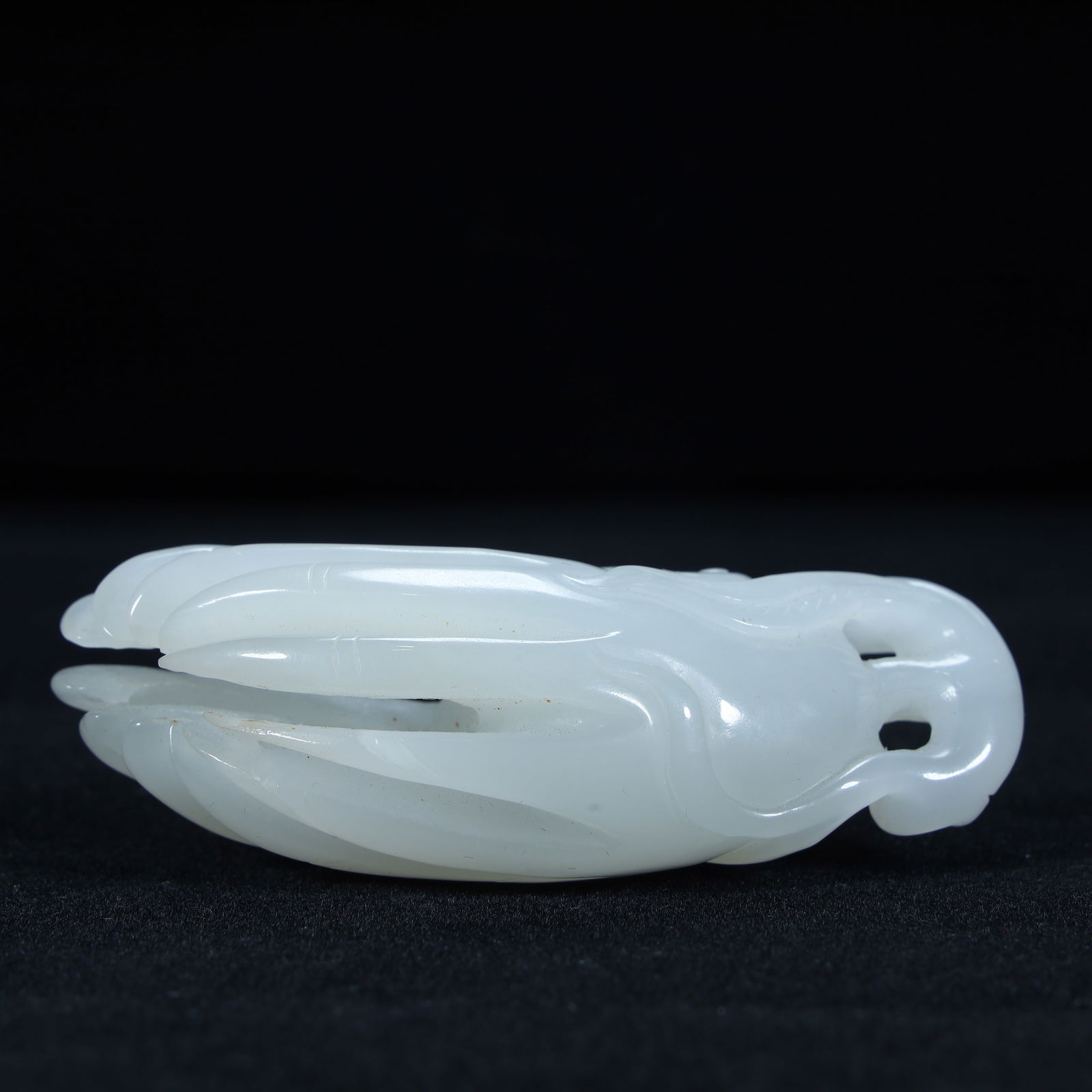 A Qing Dynasty Hetian white jade carved Buddha handle (1 of 10)