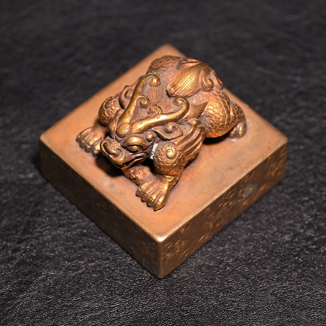 A fine copper gilt beast button seal (1 of 9)