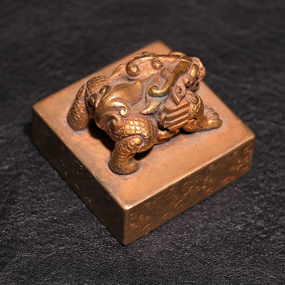 A fine copper gilt beast button seal - 5