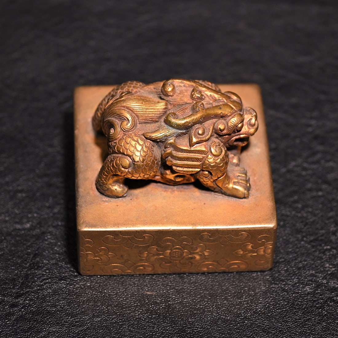 A fine copper gilt beast button seal - 6
