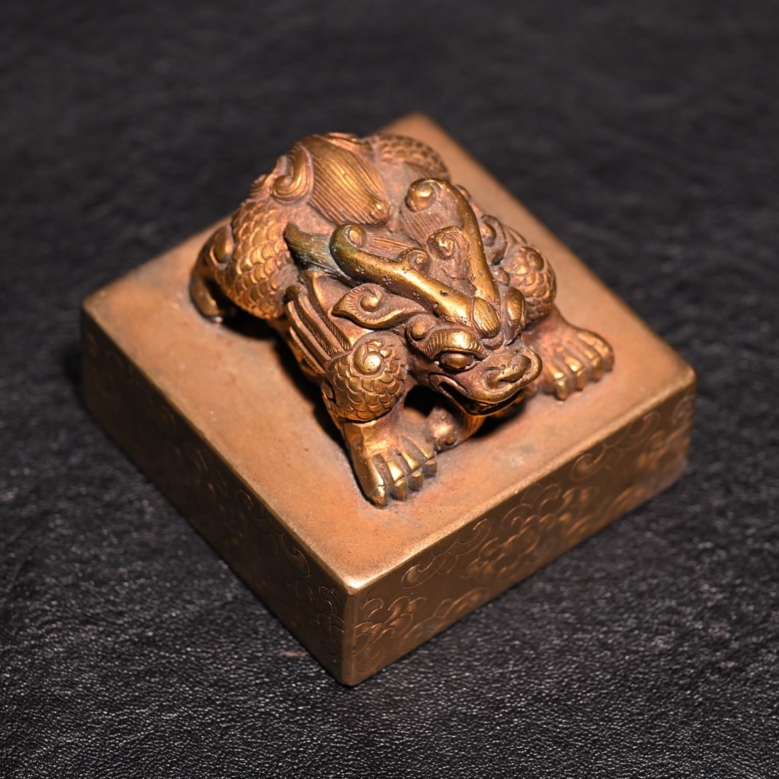 A fine copper gilt beast button seal - 7