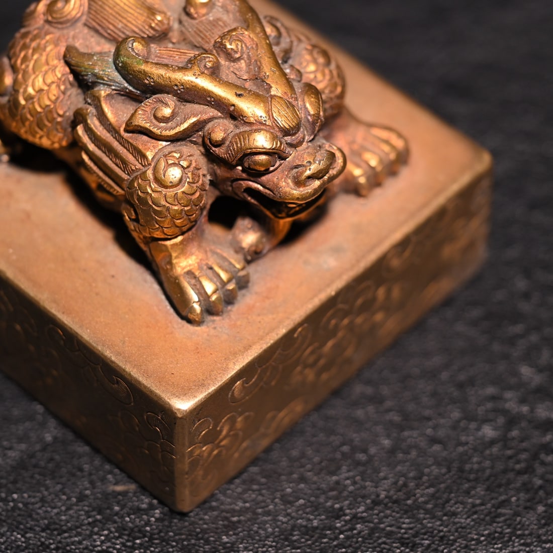 A fine copper gilt beast button seal - 8