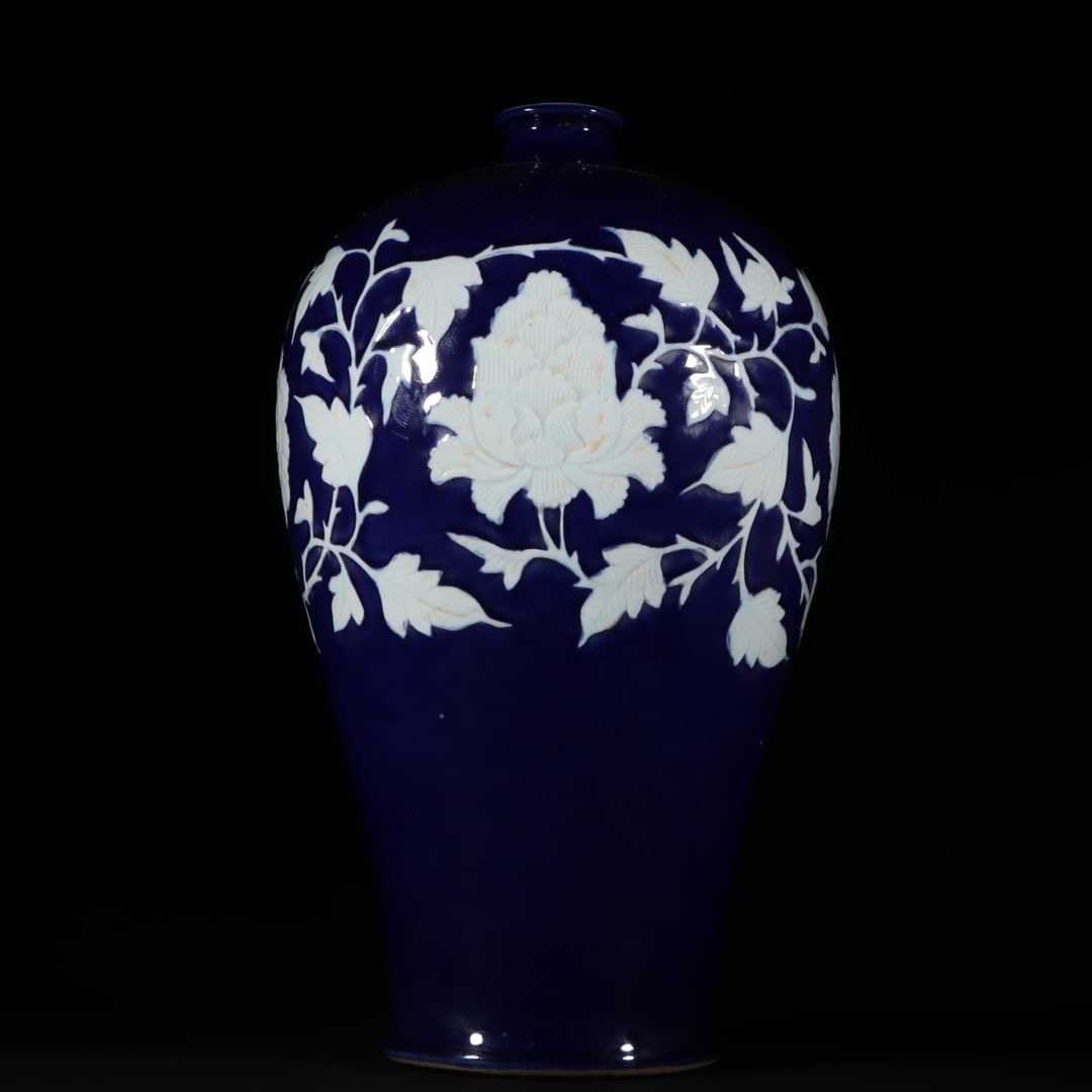 A blue glaze white carved plum vase from the Yuan Dynasty (1 of 9)