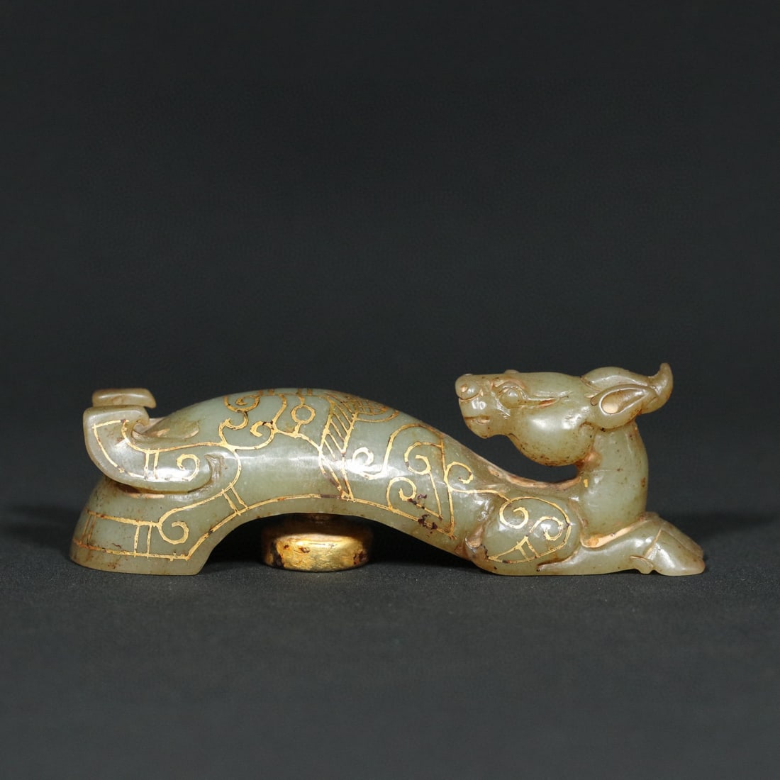 An Exquisite White Jade Gilt Beast-Face Pattern Hook: An Exquisite White Jade Gilt Beast-Face Pattern Hook Han Dynasty, China Size:9.9cmx2.8cmx3.2cm Weight:100g (The Dimensions Of All Batches Are Manually Measured.If You Need More Detailed Information, P