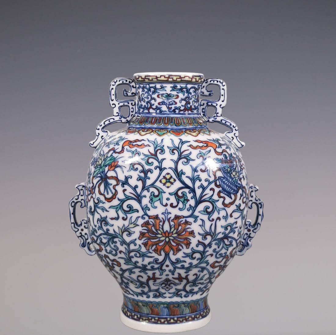An Exquisite Doucai Blue and White Lotus Pattern Eight Treasures Pattern Double-Ears Vase: An Exquisite Doucai Blue and White Lotus Pattern Eight Treasures Pattern Double-Ears Vase Qing Dynasty, China Qianlong Six-character Mark Size:22.3cmx17cm (The Dimensions Of All Batches Are