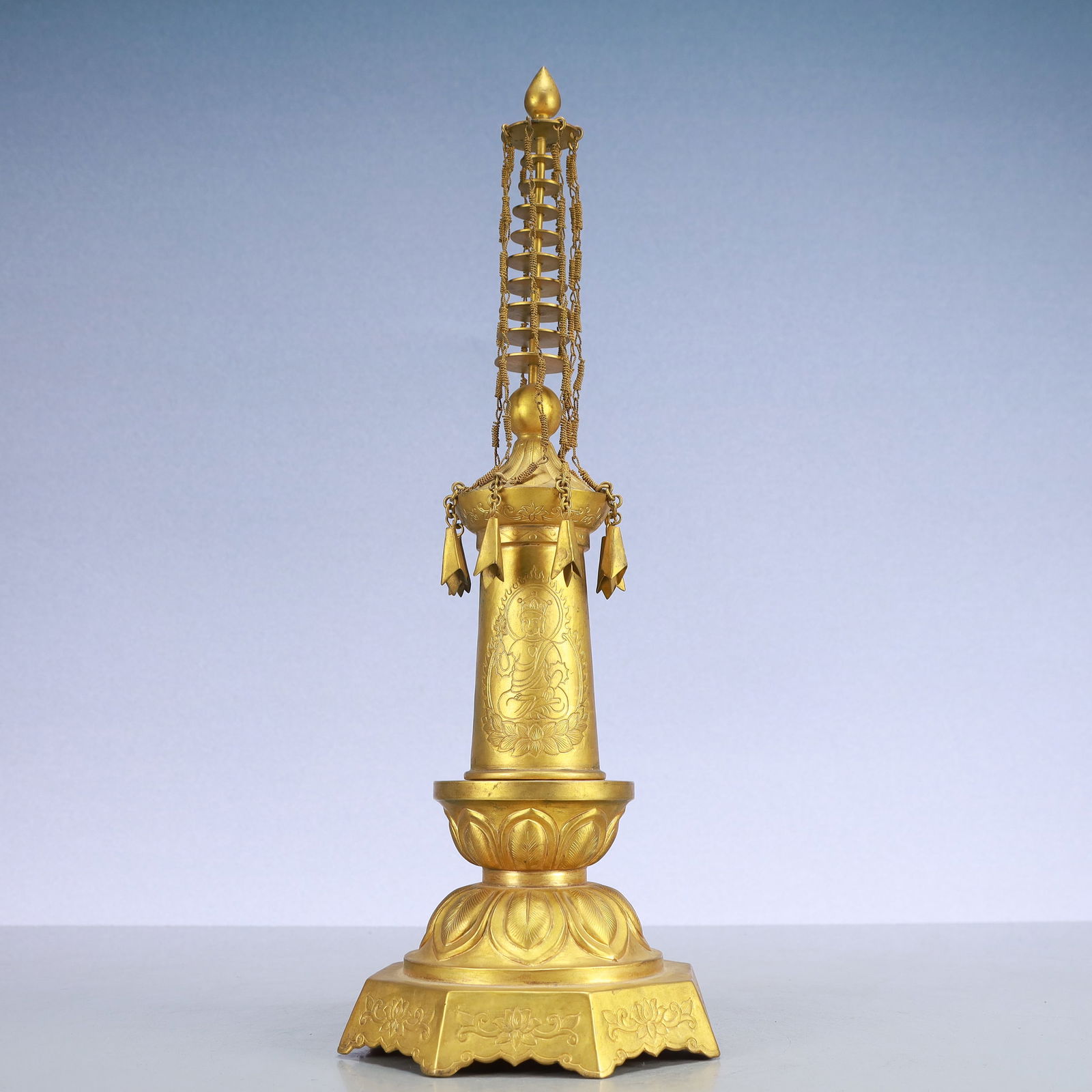 A Exquisite Gilt Bronze Buddha statue Pattern Pagoda: A Exquisite Gilt Bronze Buddha statue Pattern Pagoda Qing Dynasty, China Size:14cmx39cm Weight:1150g (The Dimensions Of All Batches Are Manually Measured.If You Need More Detailed Information,