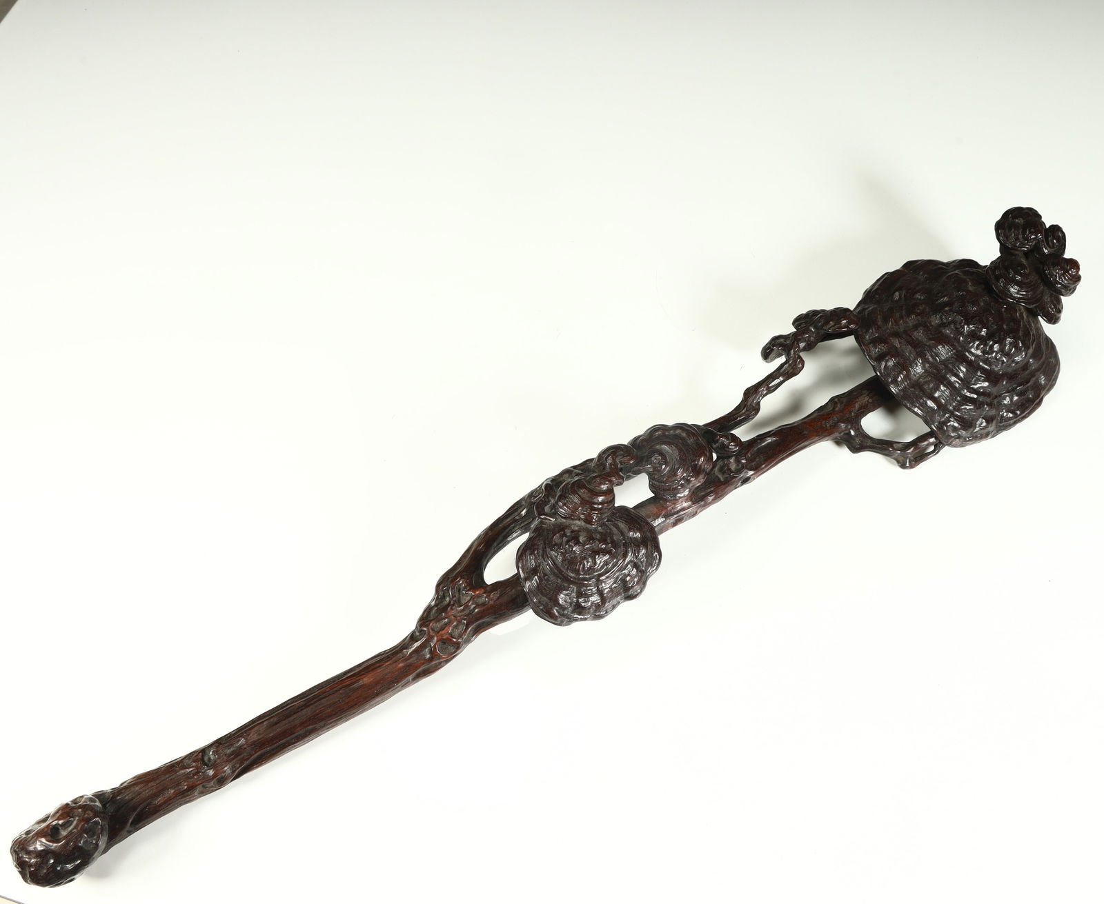 A boutique mahogany lucidum ruyi ornament from the Qing Dynasty (1 of 10)