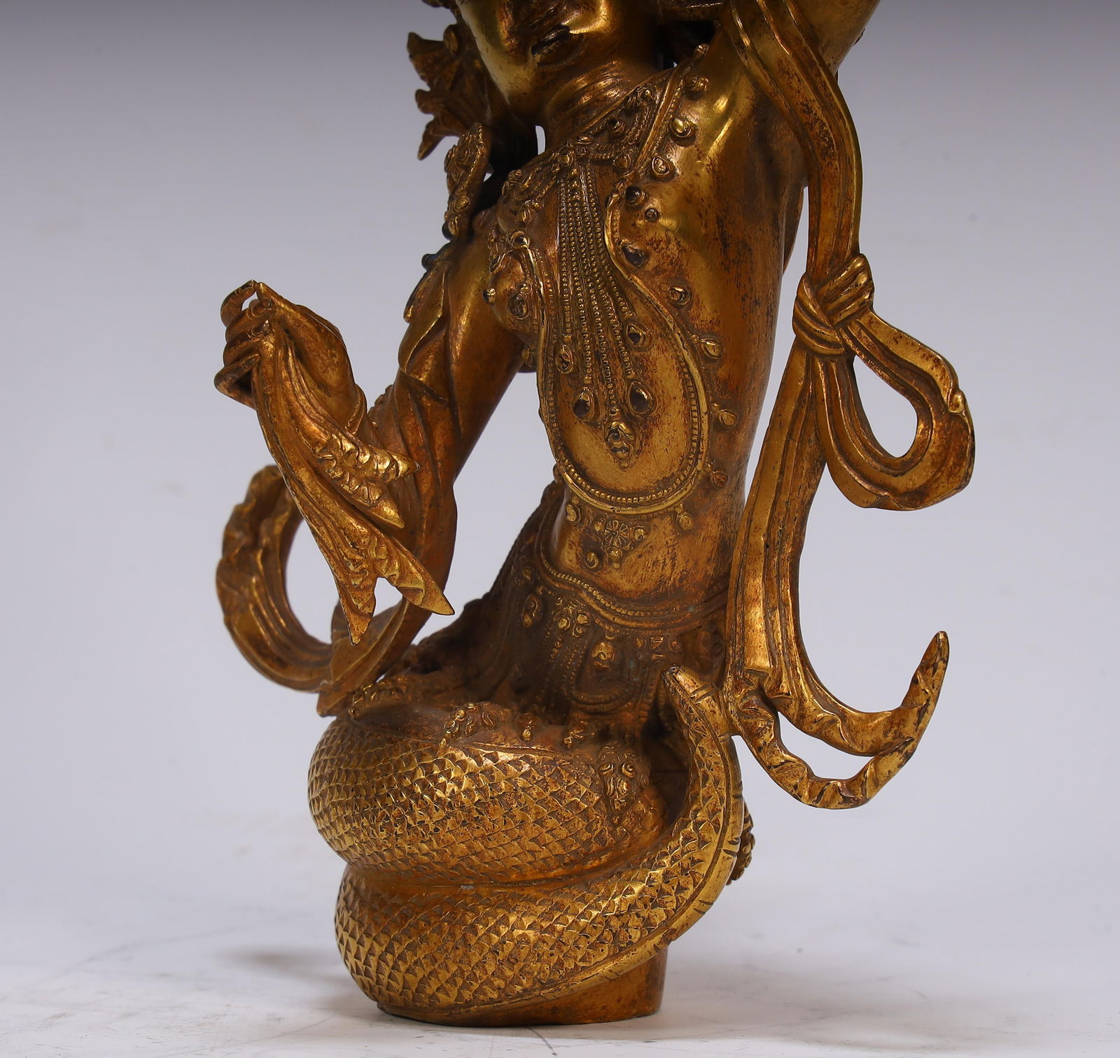 A fine copper gilt protector - 3