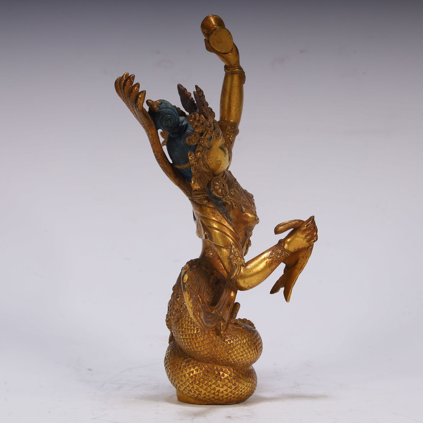 A fine copper gilt protector - 4