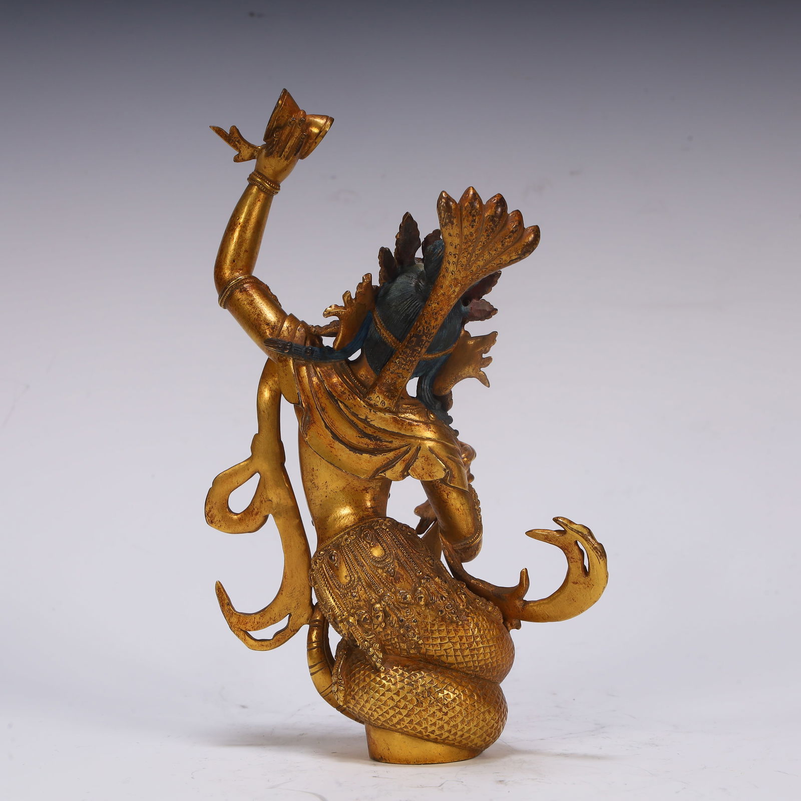 A fine copper gilt protector - 5