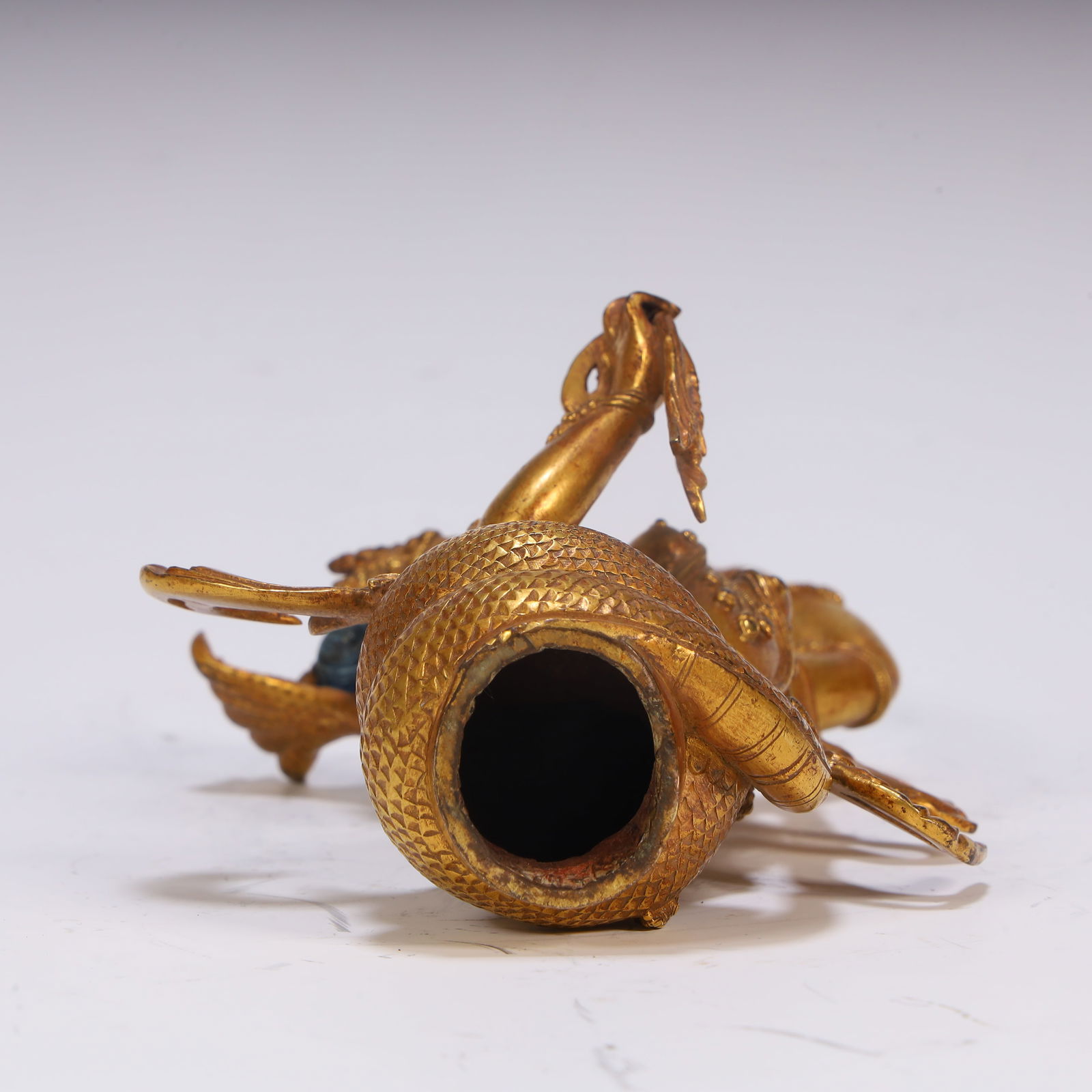 A fine copper gilt protector - 6