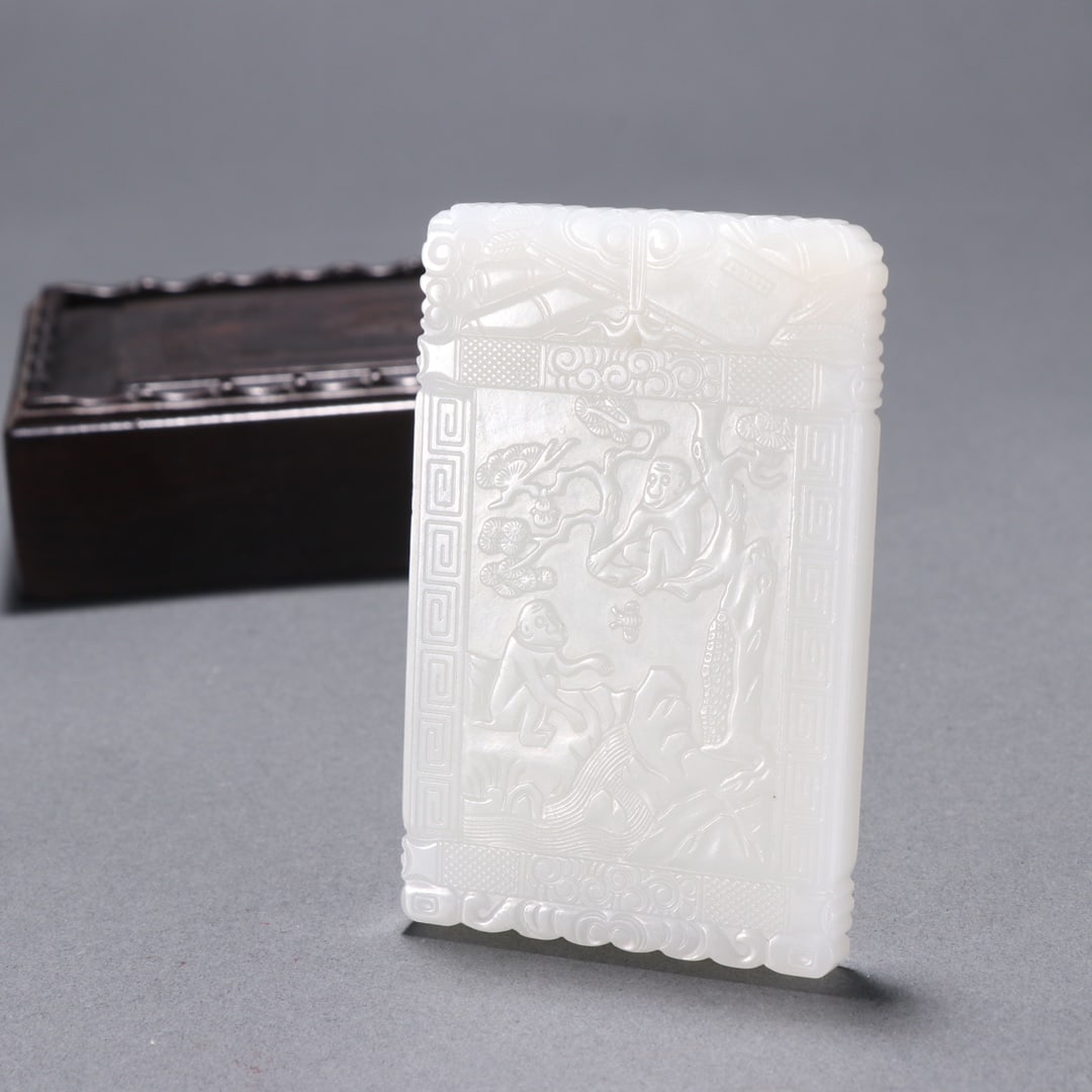 A Qing Dynasty Hetian jade carved spirit monkey poem Wenzigang card: Qing Dynasty's Hetian jade carving spirit monkey poem Wenzigang card Size:L:7.3cm W:4.65cm W:62.4g (The Dimensions Of All Batches Are Manually Measured.If You Need More Detailed Information, Please Co