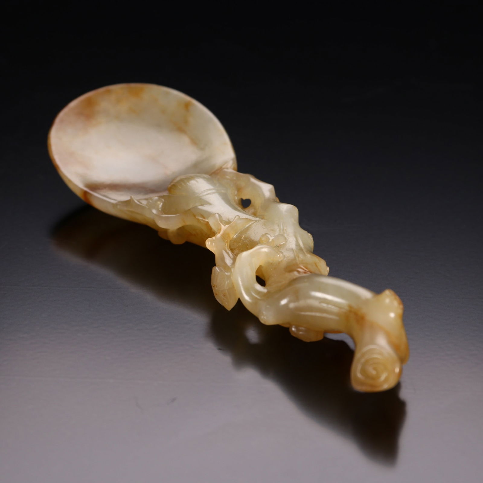 A Qing Dynasty Hetian jade seed material plum blossom pattern tea shovel: Qing Dynasty Hetian jade seed material plum blossom pattern tea shovel Sixe:H:12.5cm W:3.5cm W:51.8g (The Dimensions Of All Batches Are Manually Measured.If You Need More Detailed