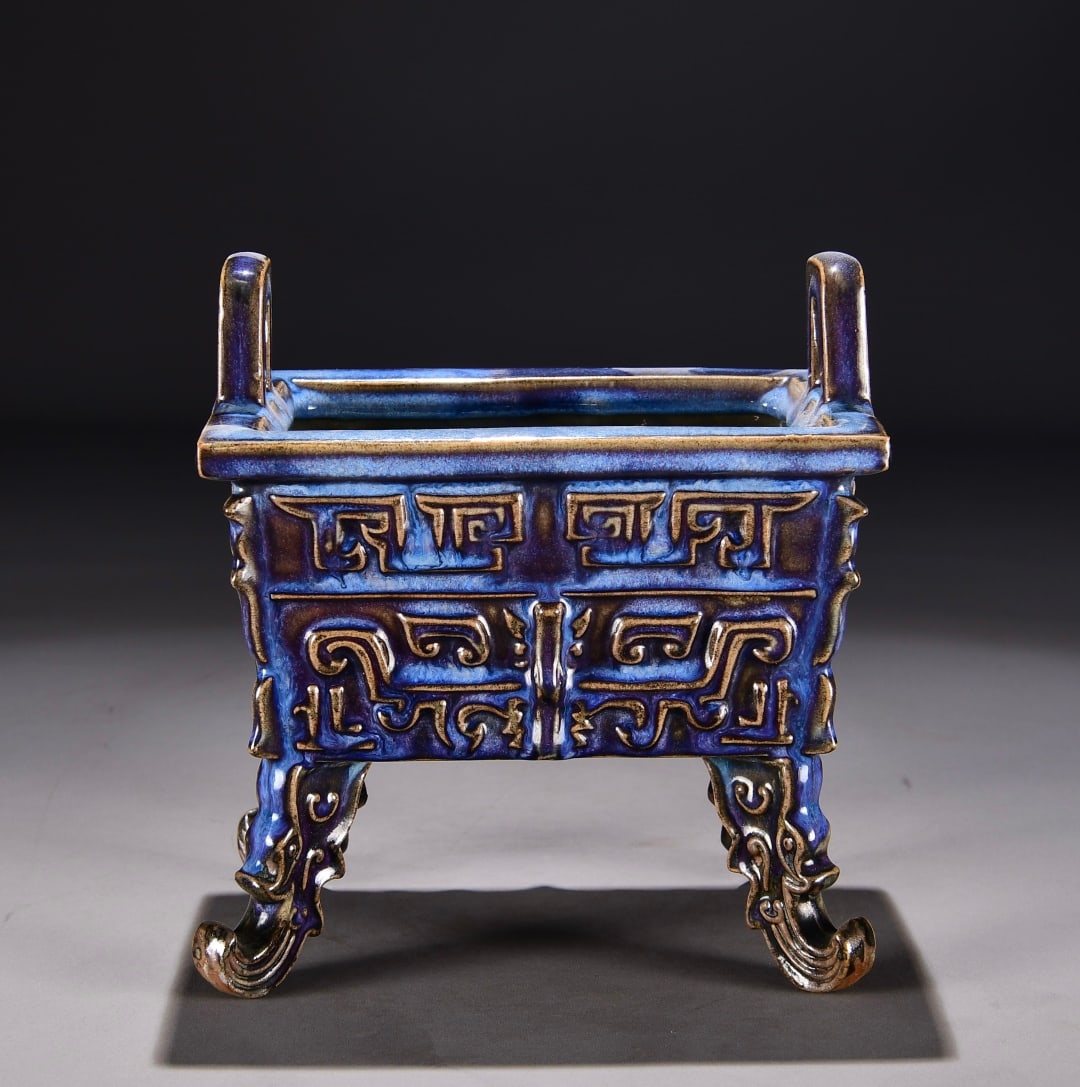 A grape purple glaze gluttonous pattern four-square tripod furnace of the Song Dynasty Jun kiln: The grape purple glaze gluttonous pattern four-square tripod furnace of the Song Dynasty Jun kiln Size:H:17cm W:20cm (The Dimensions Of All Batches Are Manually Measured.If You