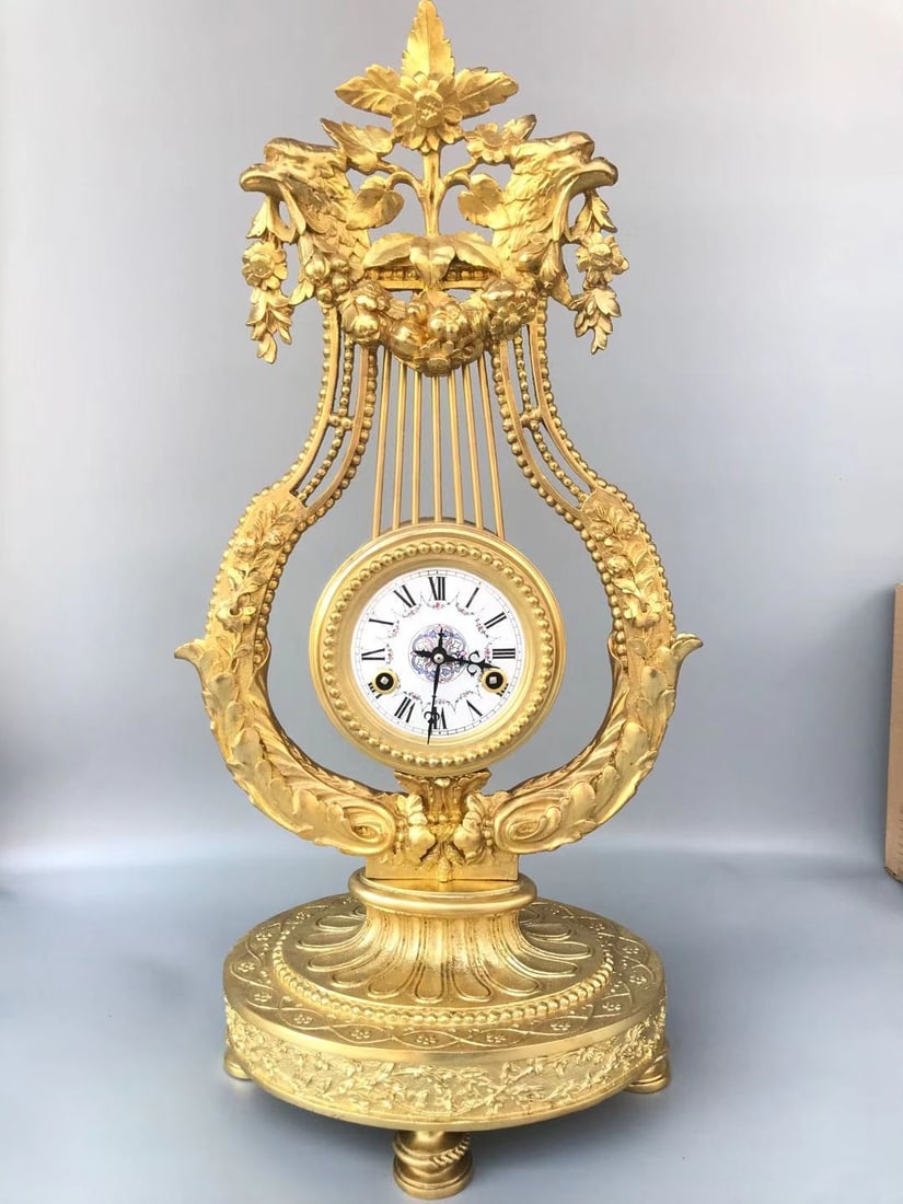 A fine century-old bronze table clock (1 of 6)