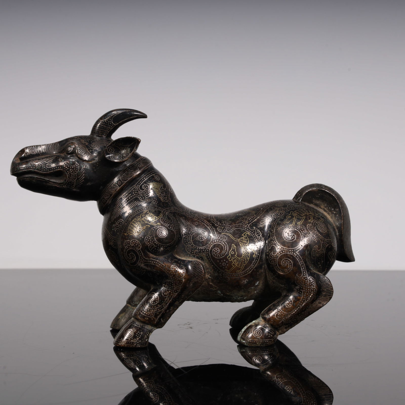 A Han Dynasty Cuojiin silver mythical beast (1 of 9)
